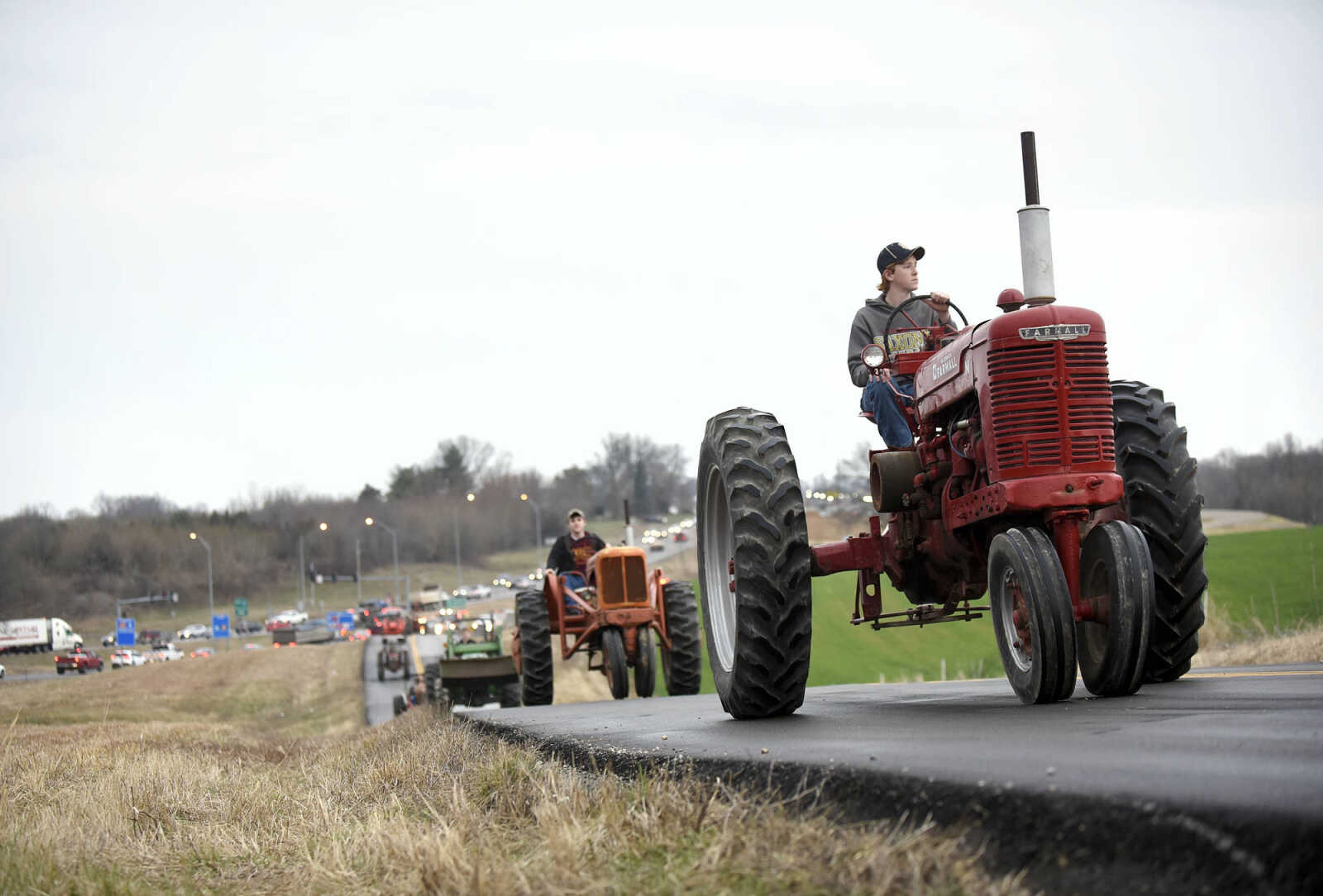 Saxony Lutheran High School FFA students take to the road on their tractors during drive your tractor to school day on Tuesday morning, Feb. 21, 2017. Students began their journey to school from Davis Farm Supply on Highway 61 in Jackson as part of FFA Week.