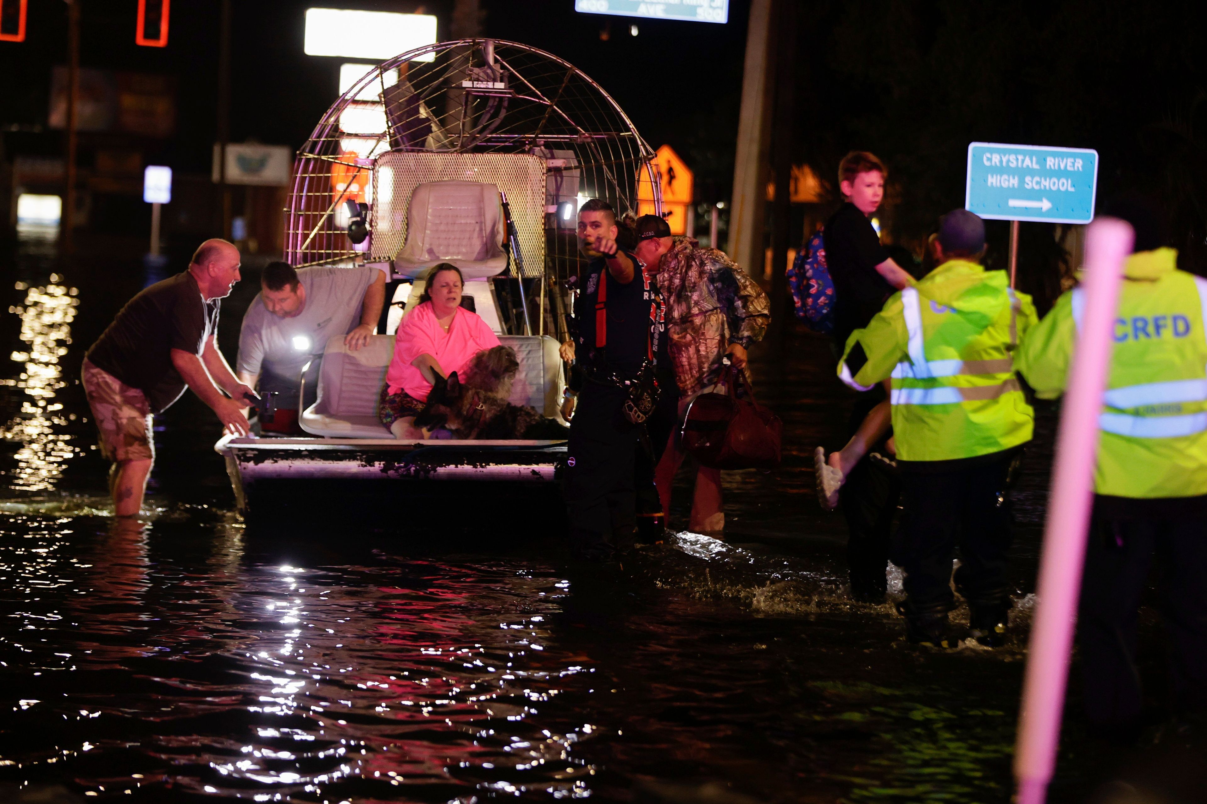 People and pets are rescued from flooded neighborhoods in the aftermath of Hurricane Helene on Friday, Sept. 27, 2024 in Crystal River, Fla. (Luis Santana/Tampa Bay Times via AP)