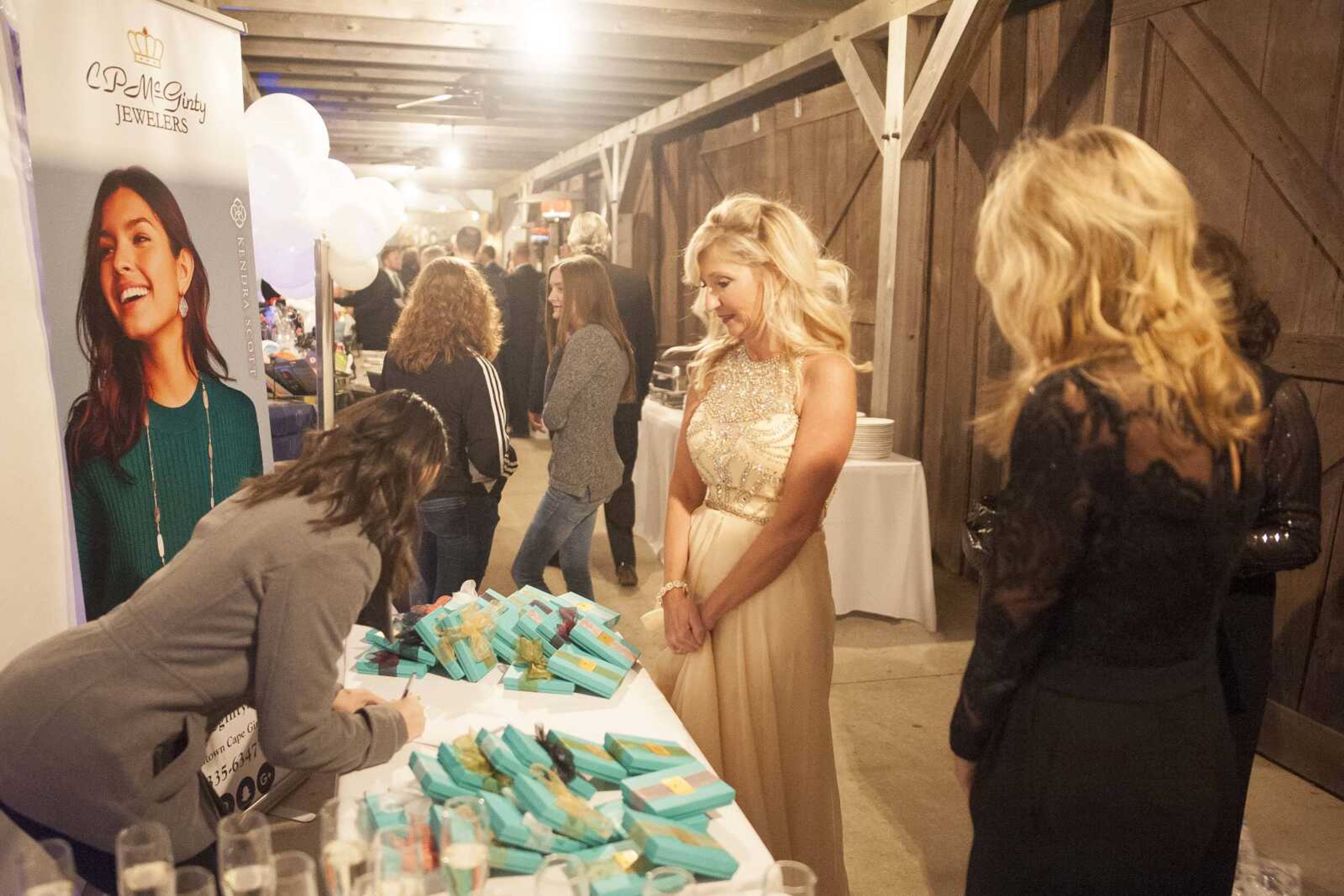 Teresa Bauer is seen at the C.P. McGinty Jewelers booth during a fundraising gala for the American Cancer Society at Rusted Route Farms Saturday, Nov. 16, 2019, in Cape Girardeau.