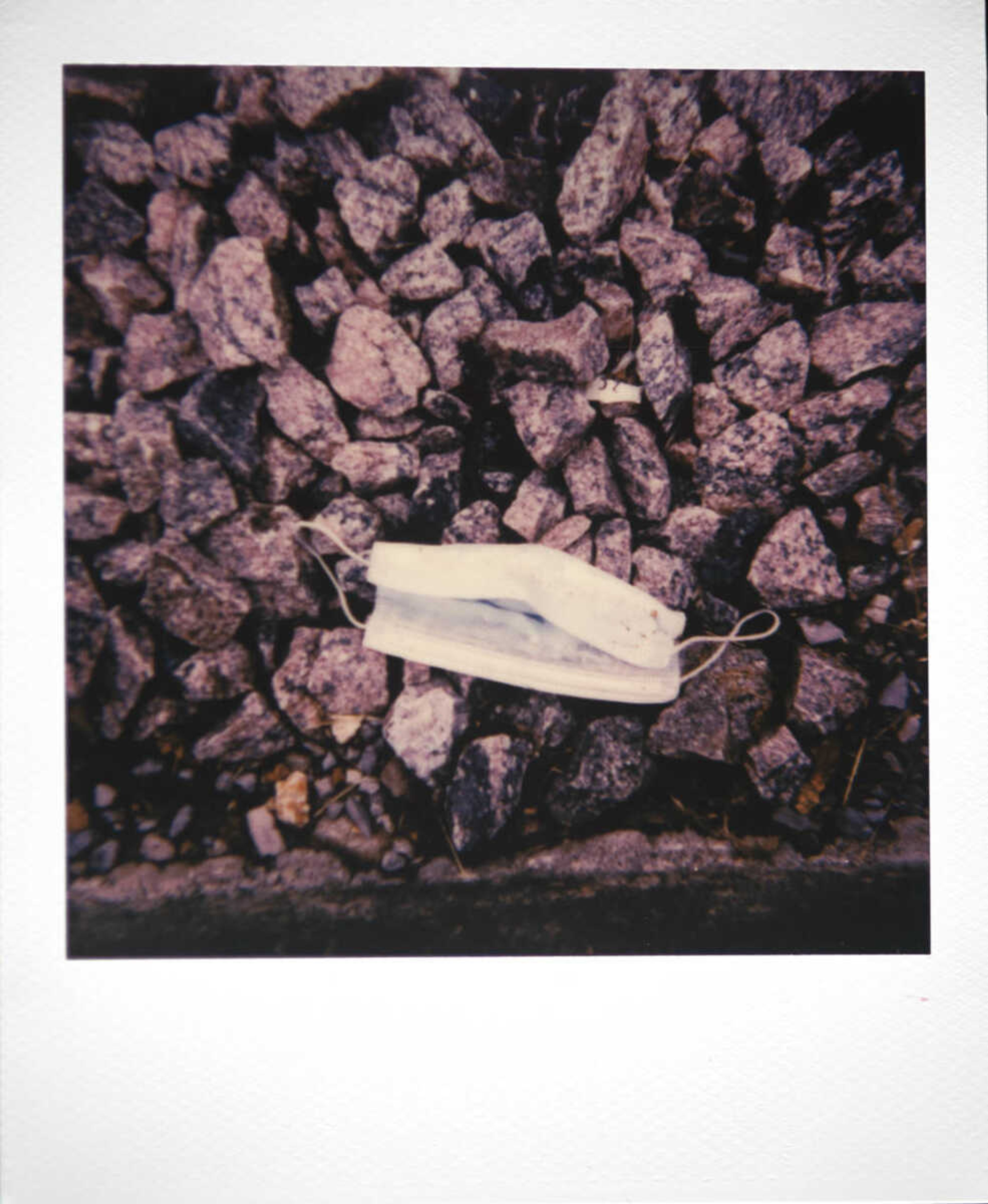 A discarded face mask sits on the ground Tuesday, June 9, 2020, near the railroad tracks in downtown Cape Girardeau.