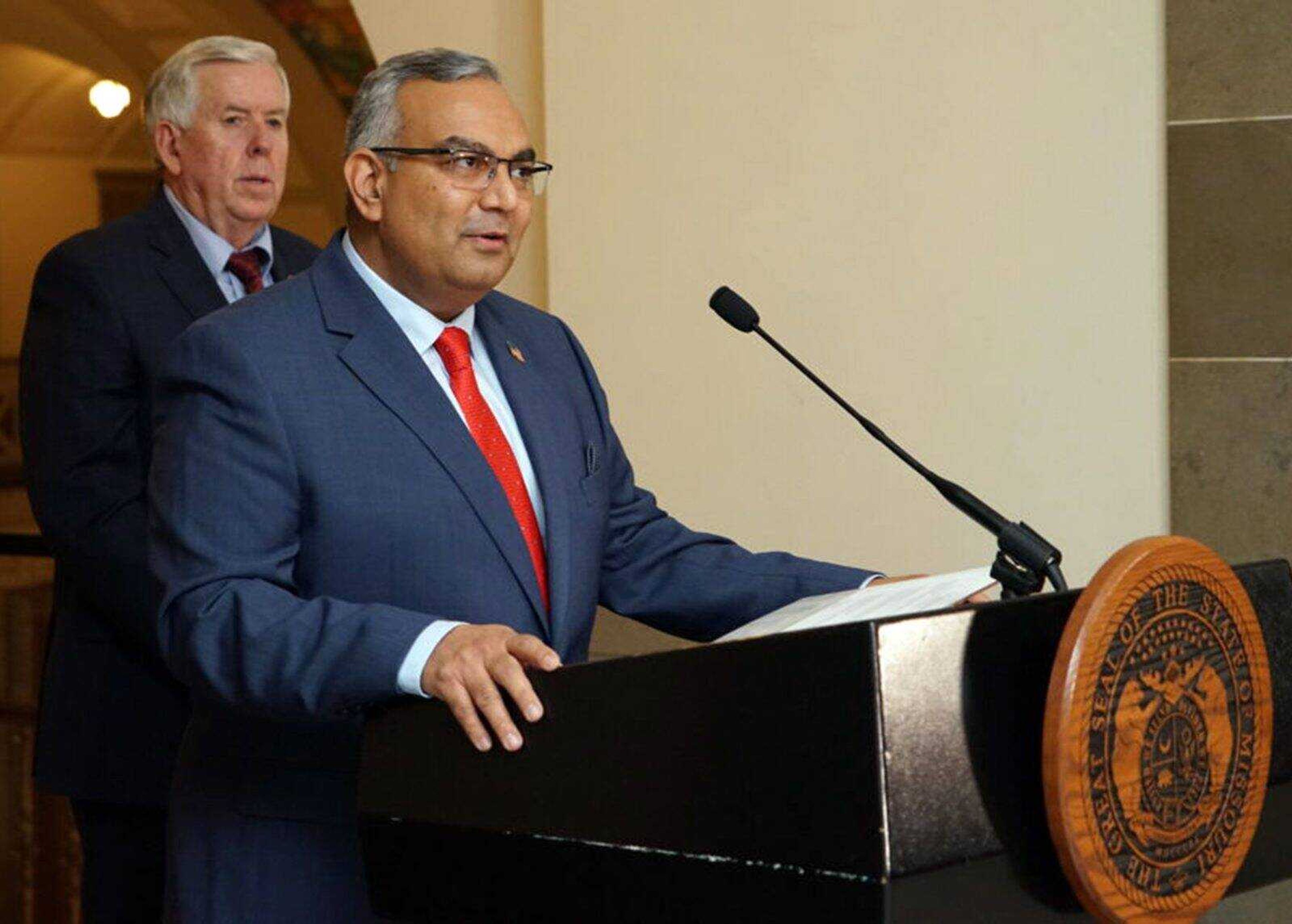 Vivek Malek, right, speaks Dec. 20 after being announced as the next Missouri state treasurer by Gov. Mike Parson.