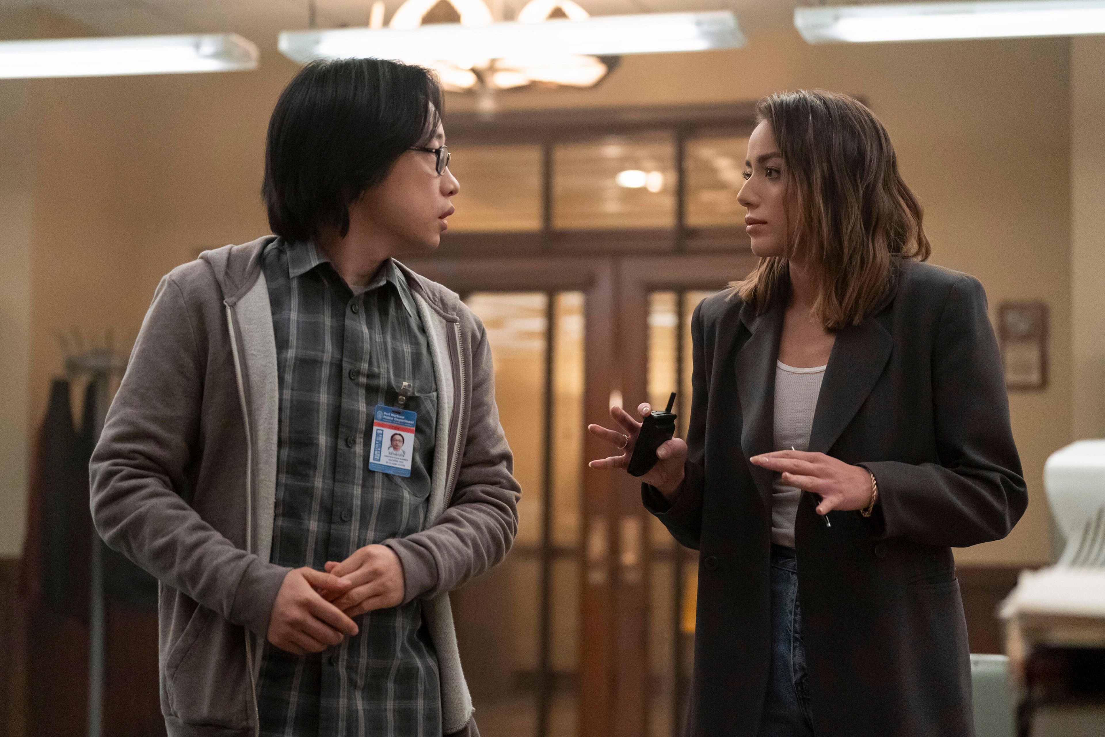 This image released by Hulu shows Chloe Bennet, right, and Jimmy O. Yang in a scene from the series "Interior Chinatown." (Mike Taing/Hulu via AP)