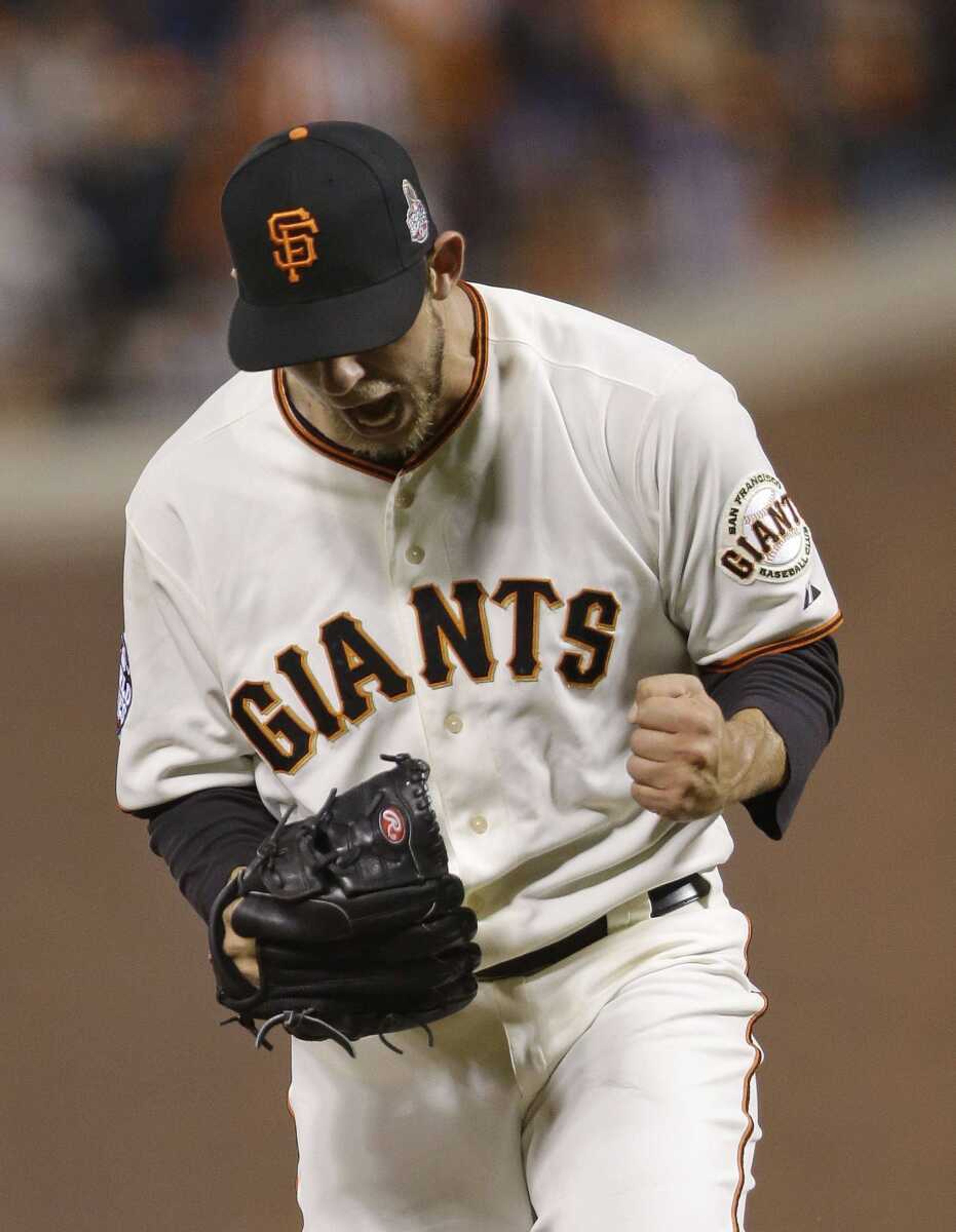 Giants pitcher Madison Bumgarner reacts after striking out the Tigers&#8217; Omar Infante during the sixth inning of Game 2 of the World Series on Thursday in San Francisco. (Marcio Jose Sanchez ~ Associated Press)