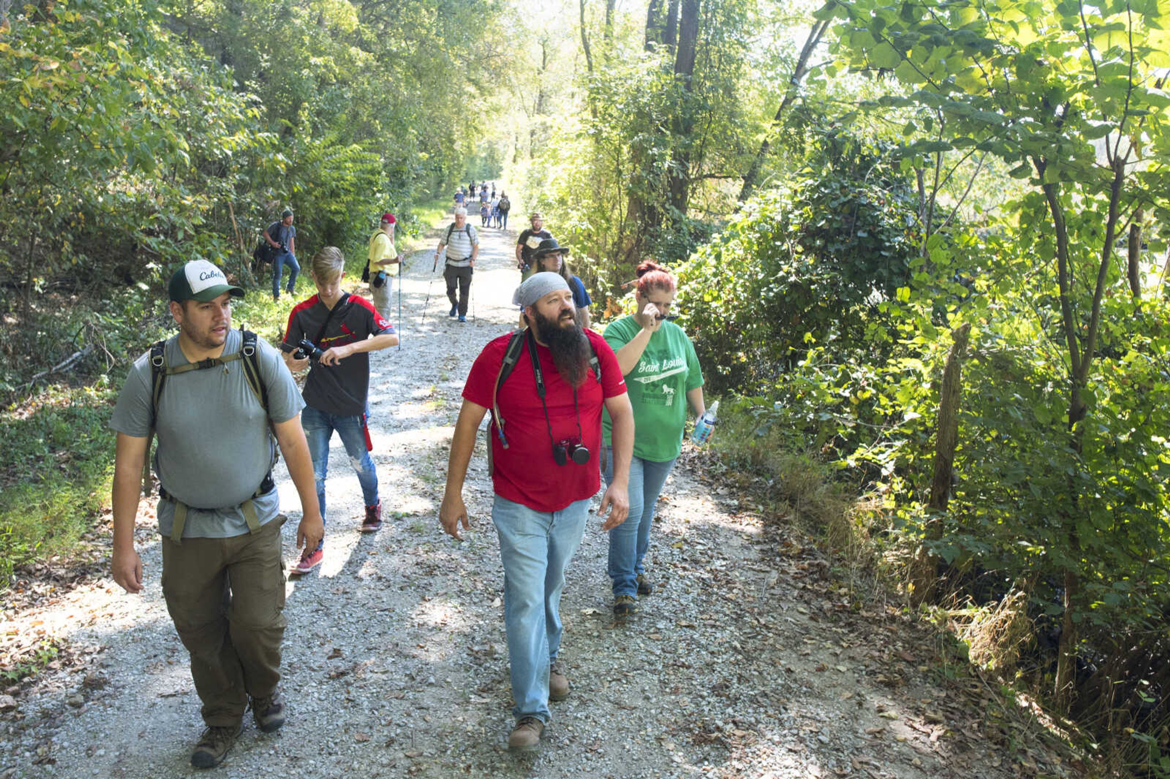 p.p1 {margin: 0.0px 0.0px 0.0px 0.0px; font: 12.0px 'Lucida Grande'}



From front left, Nick Scobel of Ann Arbor, Michigan, walks with Joseph Schumacher of Carbondale, Illinois, and his parents, Jeremy and Jill Schumacher, while looking for wildlife along Snake Road in Wolf Lake, Illinois.&nbsp;