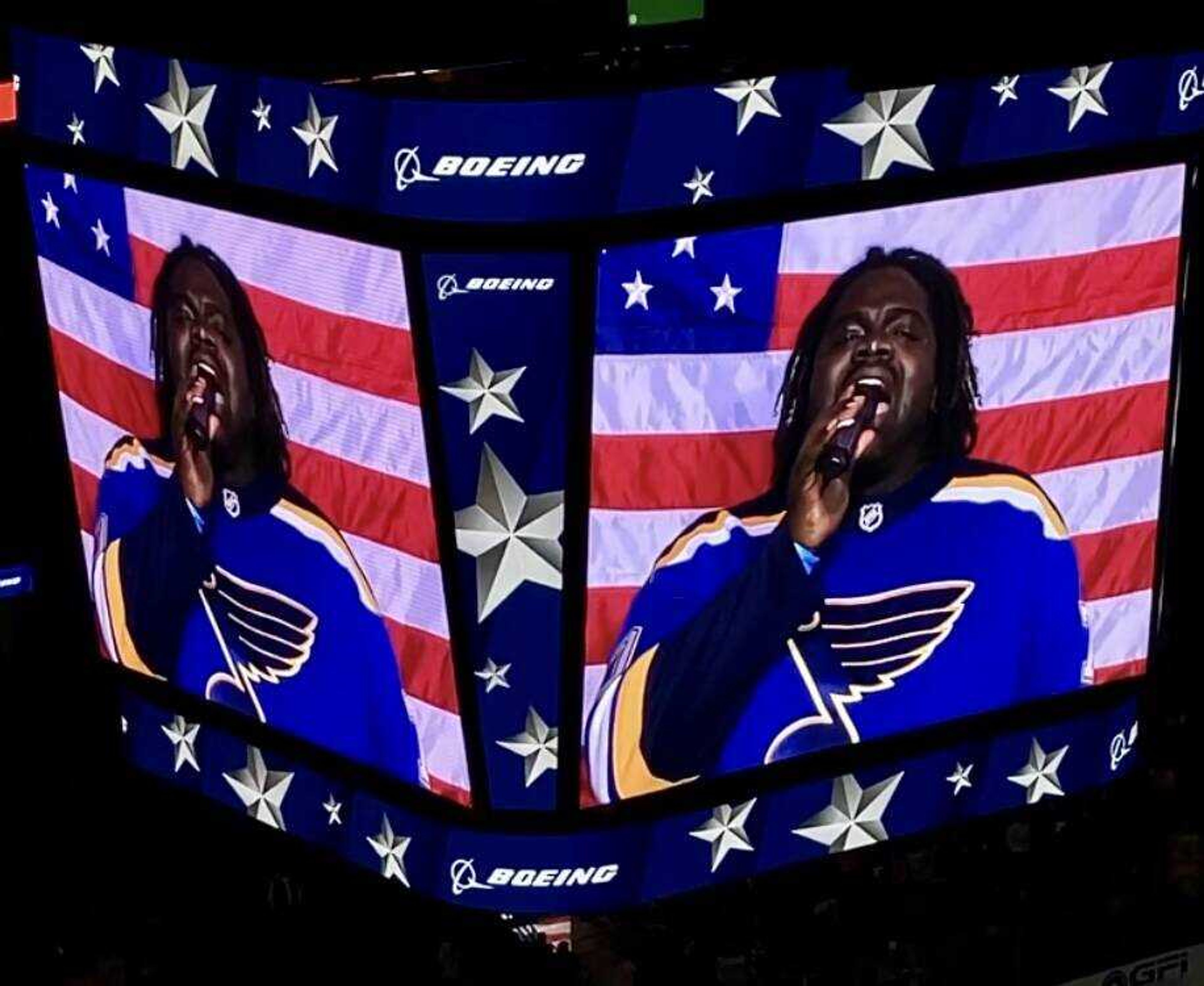 Notre Dame tennis coach Pershard Owens sings “God Bless America” during an NHL game between the St. Louis Blues and Arizona Coyotes on Nov. 16, 2023 in St. Louis.