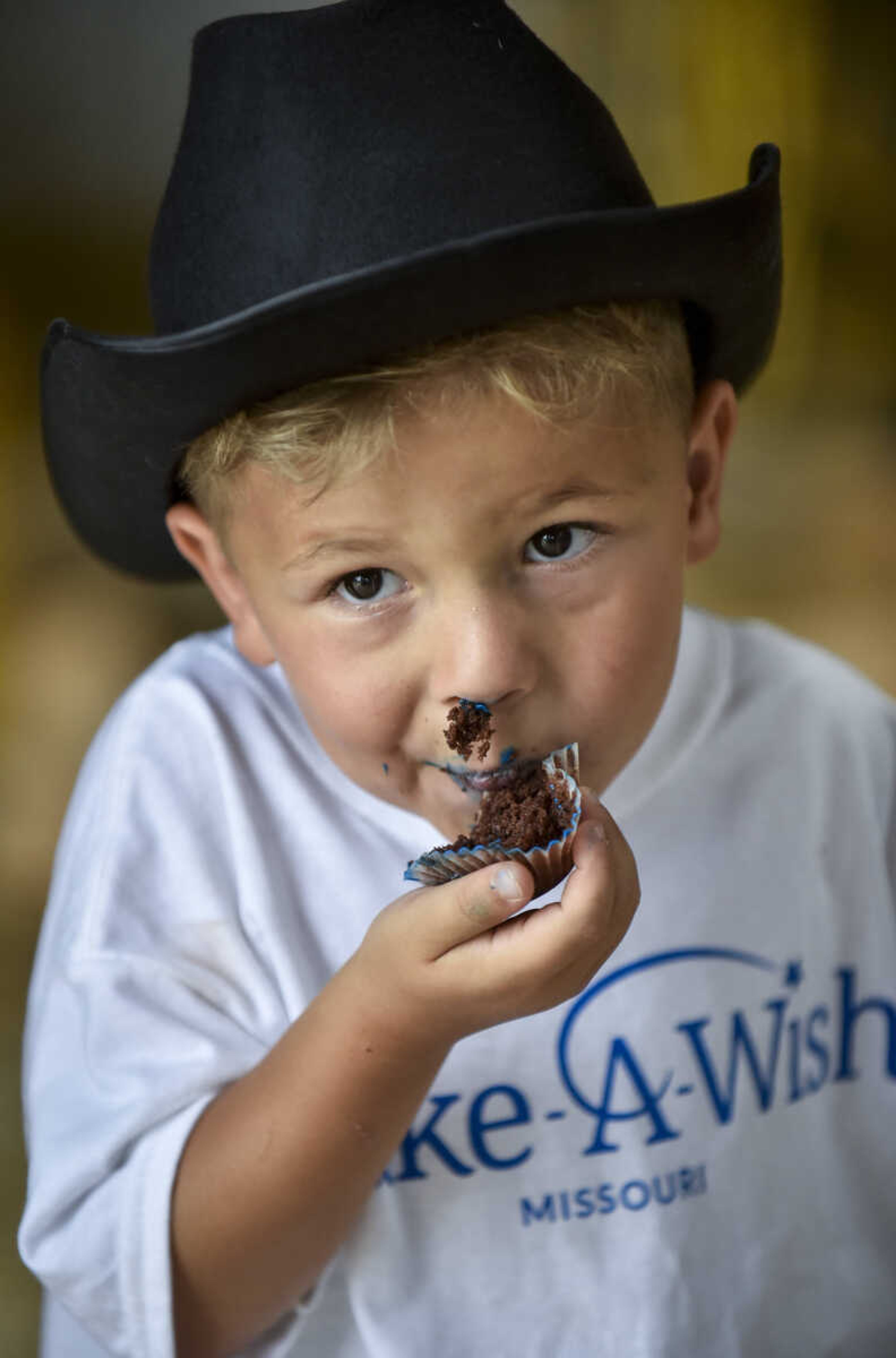 Nate Prichard, 5, eats a cupcake in his barn after spending time with his new horse Monday, July 30, 2018 in&nbsp;Burfordville.