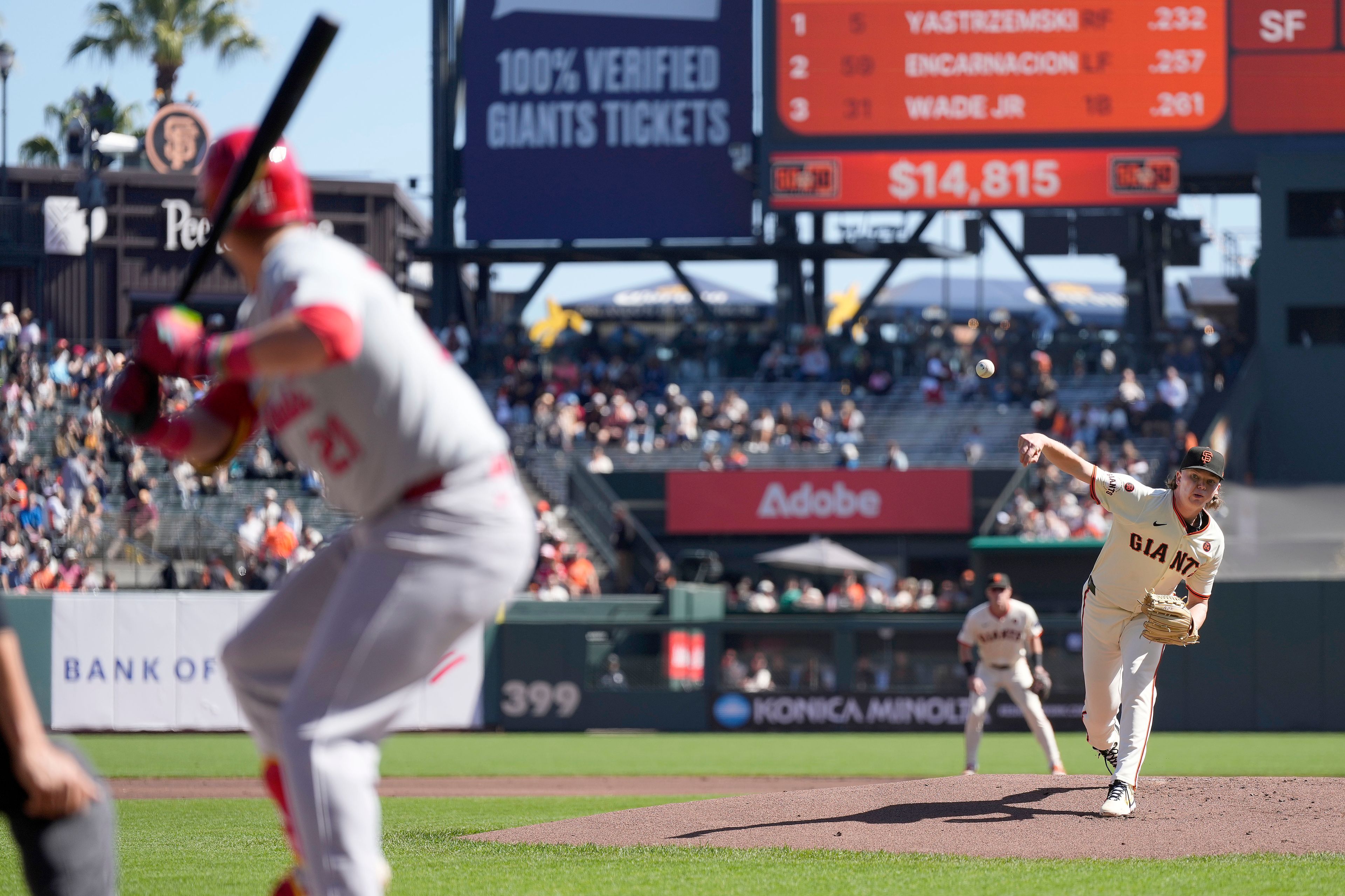 San Francisco Giants pitcher Hayden Birdsong, right, throws against St. Louis Cardinals' Lars Nootbaar, left, during the first inning of a baseball game Sunday, Sept. 29, 2024, in San Francisco. (AP Photo/Tony Avelar)