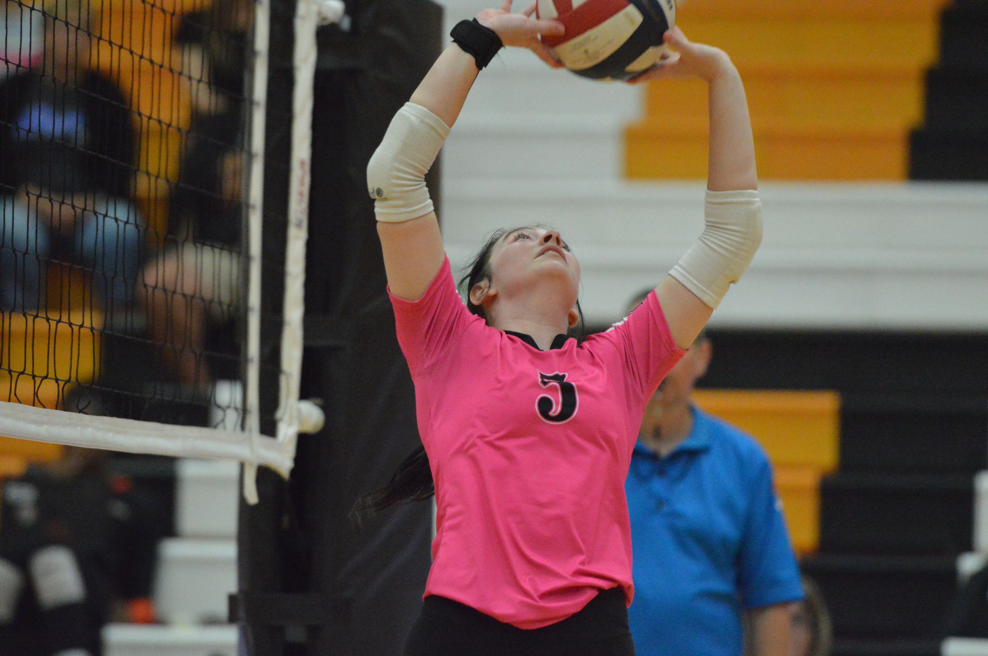 Cape Central's Ella Hukel sets the ball for her teammates against Bernie on Monday, Sept. 16.