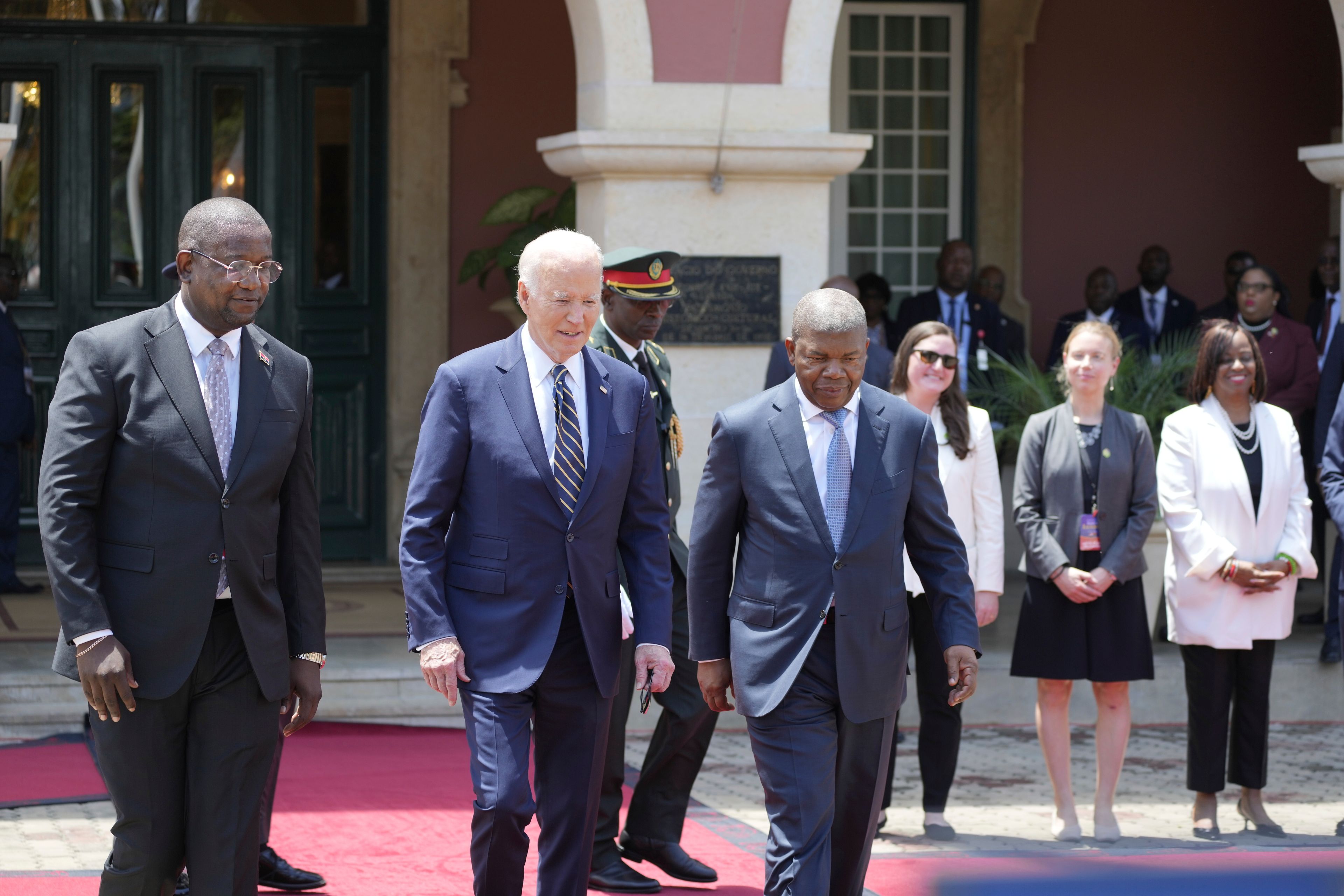 President Joe Biden inspects the honor guard with Angola's President Joao Lourenco, at the presidential palace in the capital Luanda, Angola on Tuesday, Dec. 3, 2024. (AP Photo/Ben Curtis)