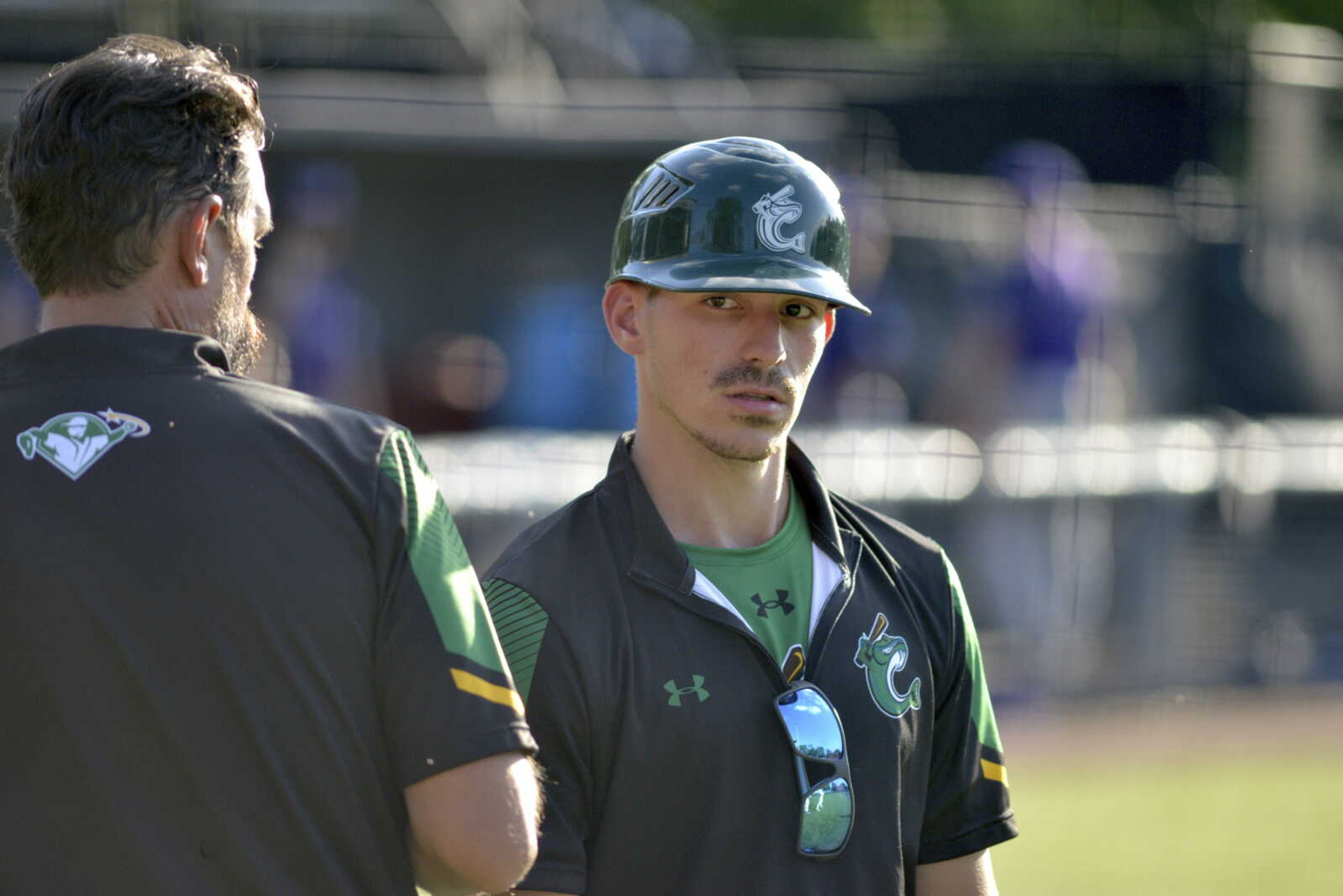 First-year Cape Catfish assistant coach Nolan Davenport speaks with manager Phil Butler during a game earlier this month at Capaha Field.