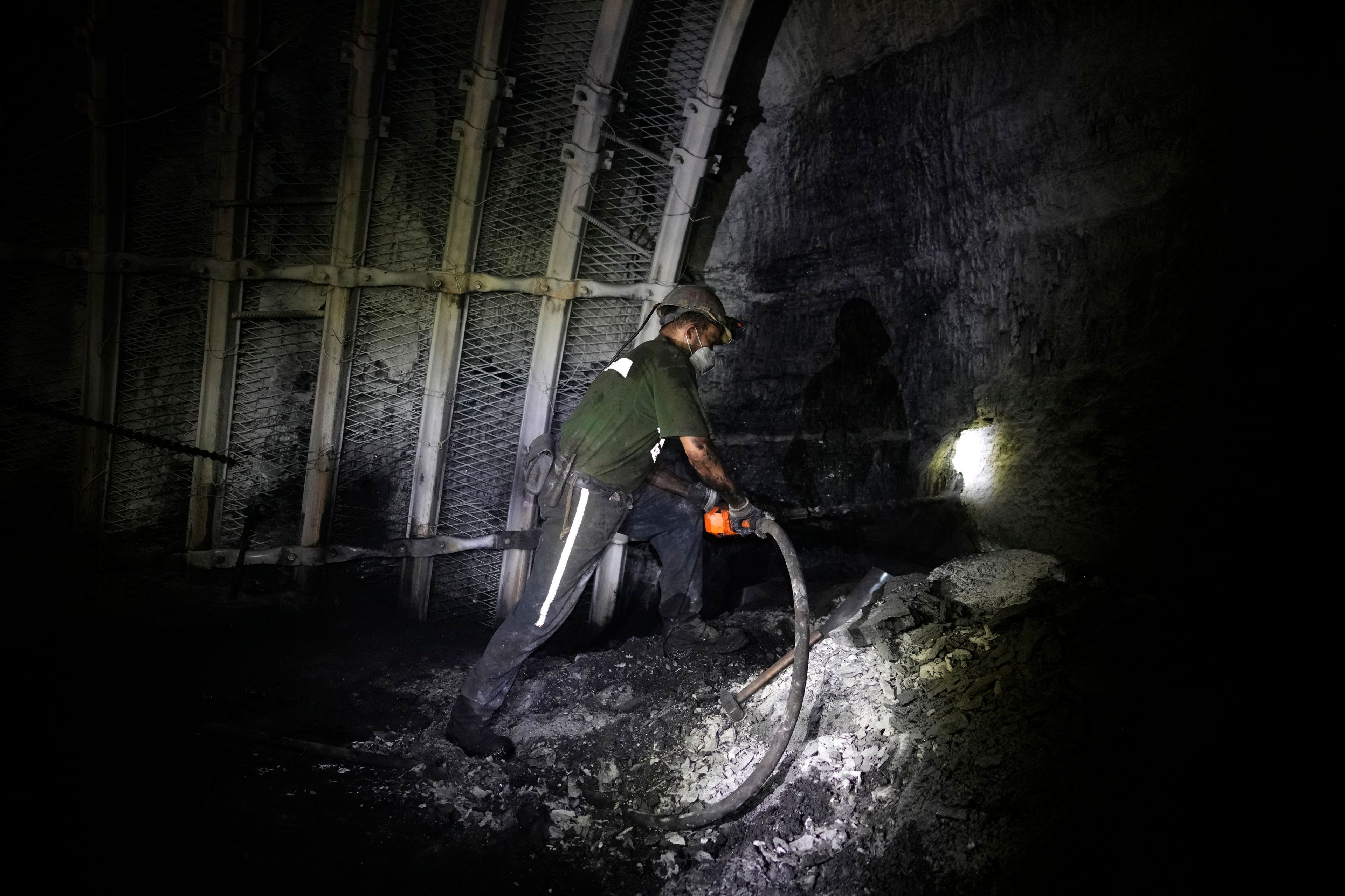 A miner drills in the CSM coal mine in Stonava, Czech Republic, Monday, Oct. 14, 2024. (AP Photo/Petr David Josek)