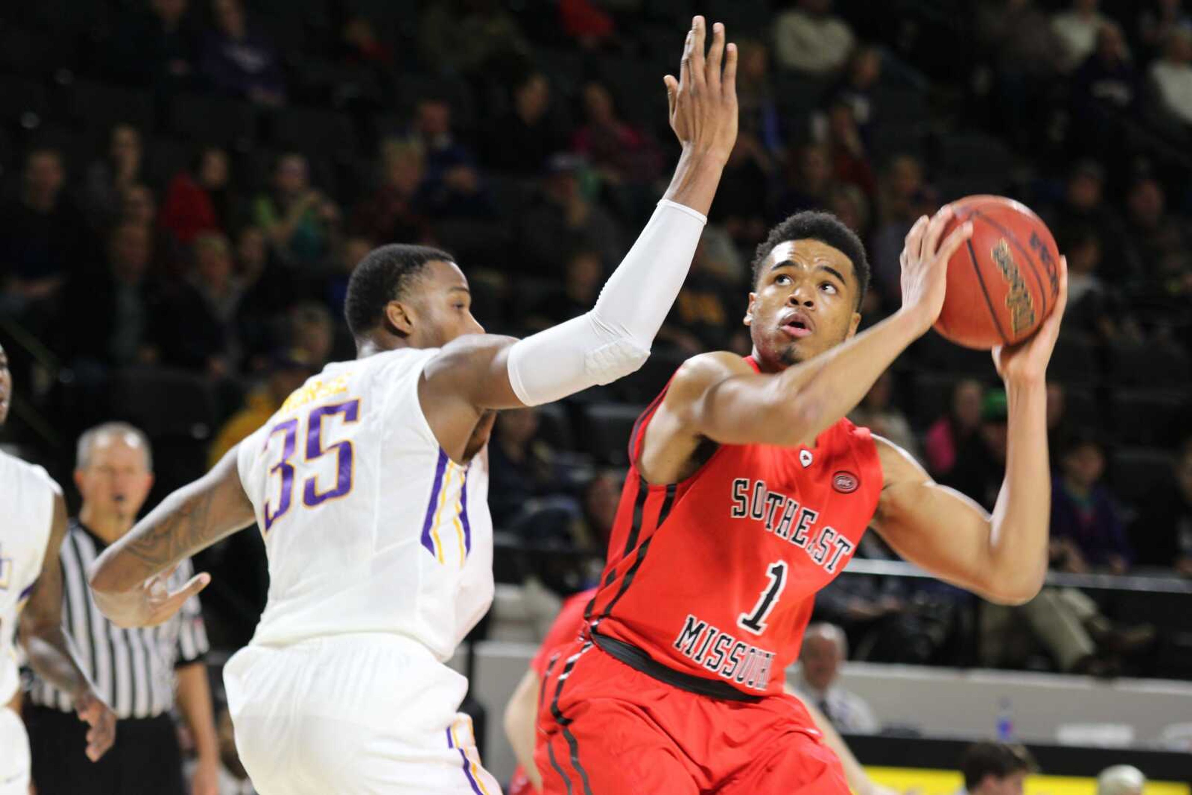 Southeast Missouri State's Tony Anderson is defended by Tennessee Tech's Anthony Morse during Saturday's game in Cookeville, Tennessee. (Tony Marable ~ Cookeville Herald Citizen)