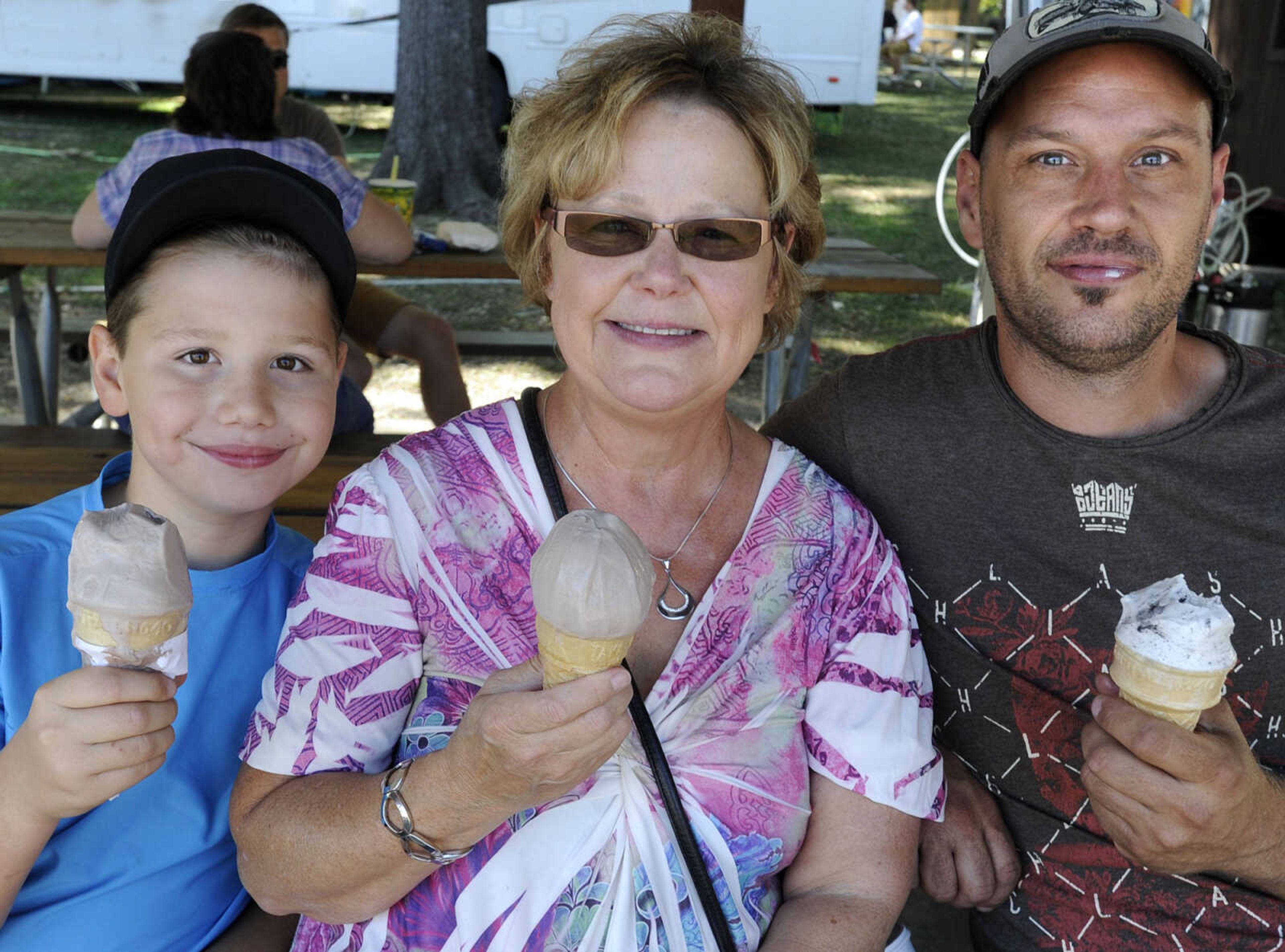 Donna Rhodes and her grandson, Landon Cochran, left, and son, James Fisk, of Oran, Missouri pose for a photo Sunday, Sept. 7, 2014 at the SEMO District Fair.