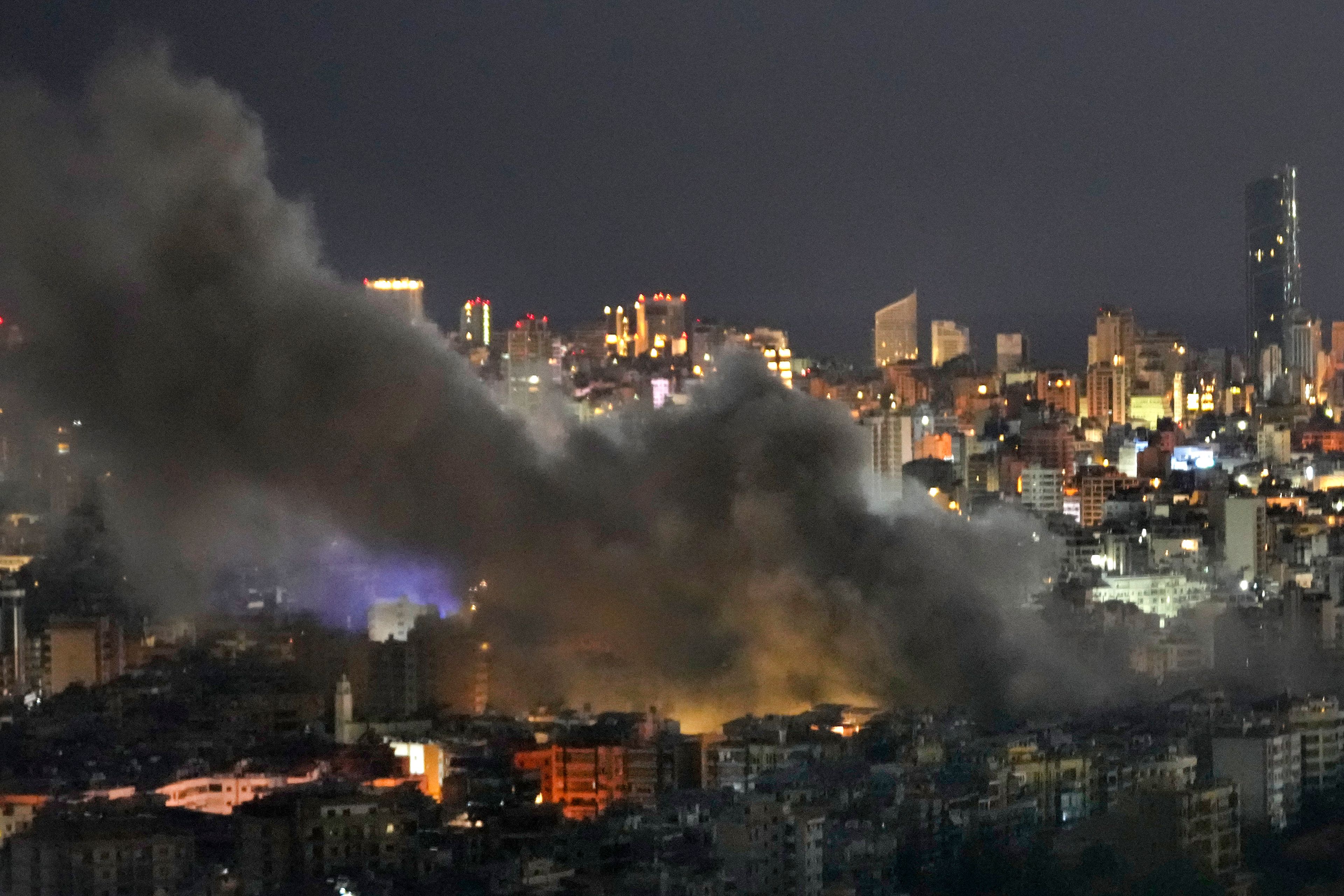 Smoke rises from Israeli airstrikes on Dahiyeh, in the southern suburb of Beirut, Lebanon, early Sunday, Oct. 20, 2024. (AP Photo/Hussein Malla)