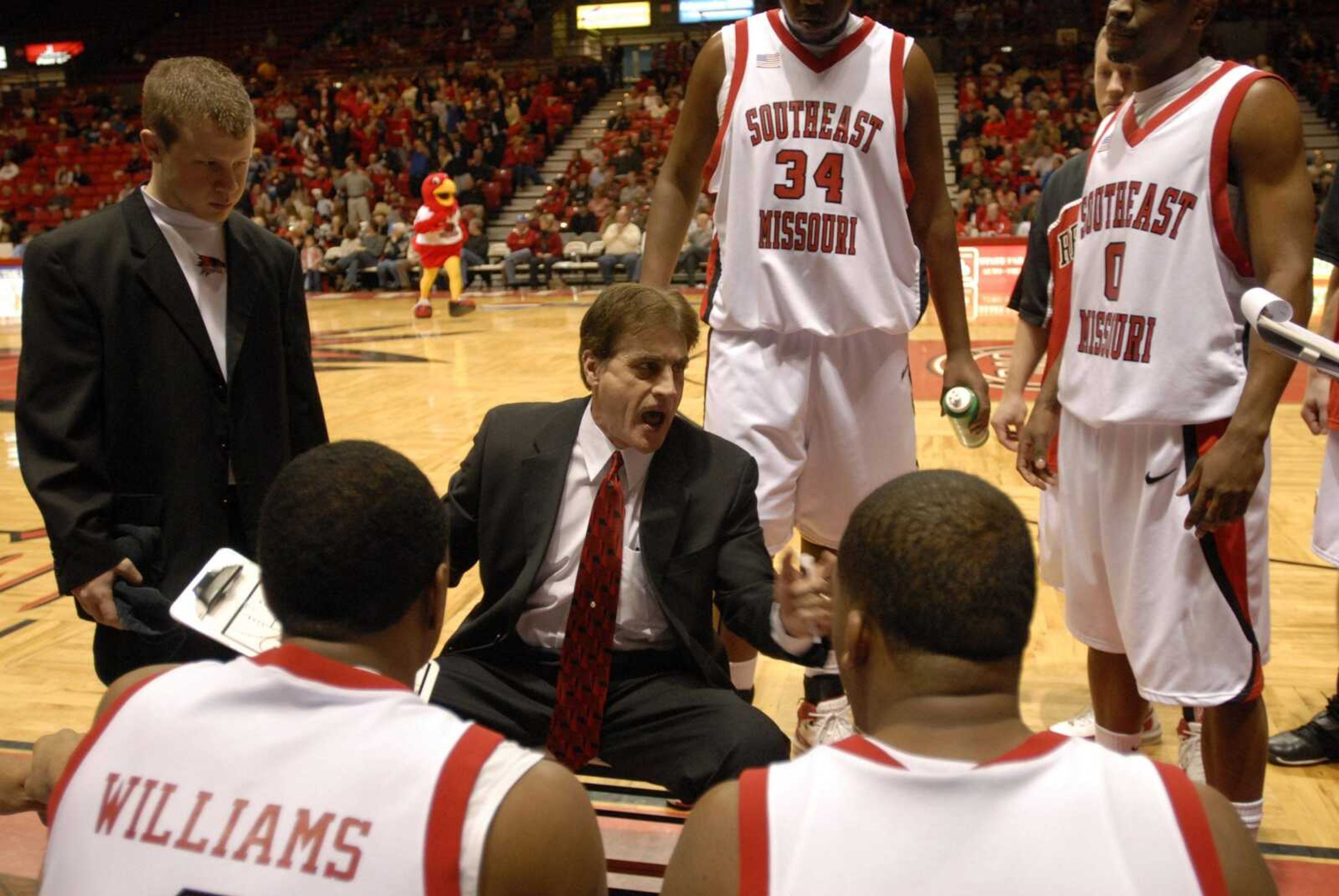 Southeast Missouri State University coach Scott Edgar encouraged his players during a timeout against Morehead State in early 2008. The NCAA announced sanctions Thursday against the program for violations in the men's basketball program under Scott Edgar, and violations in the women's basketball program. (Kit Doyle)