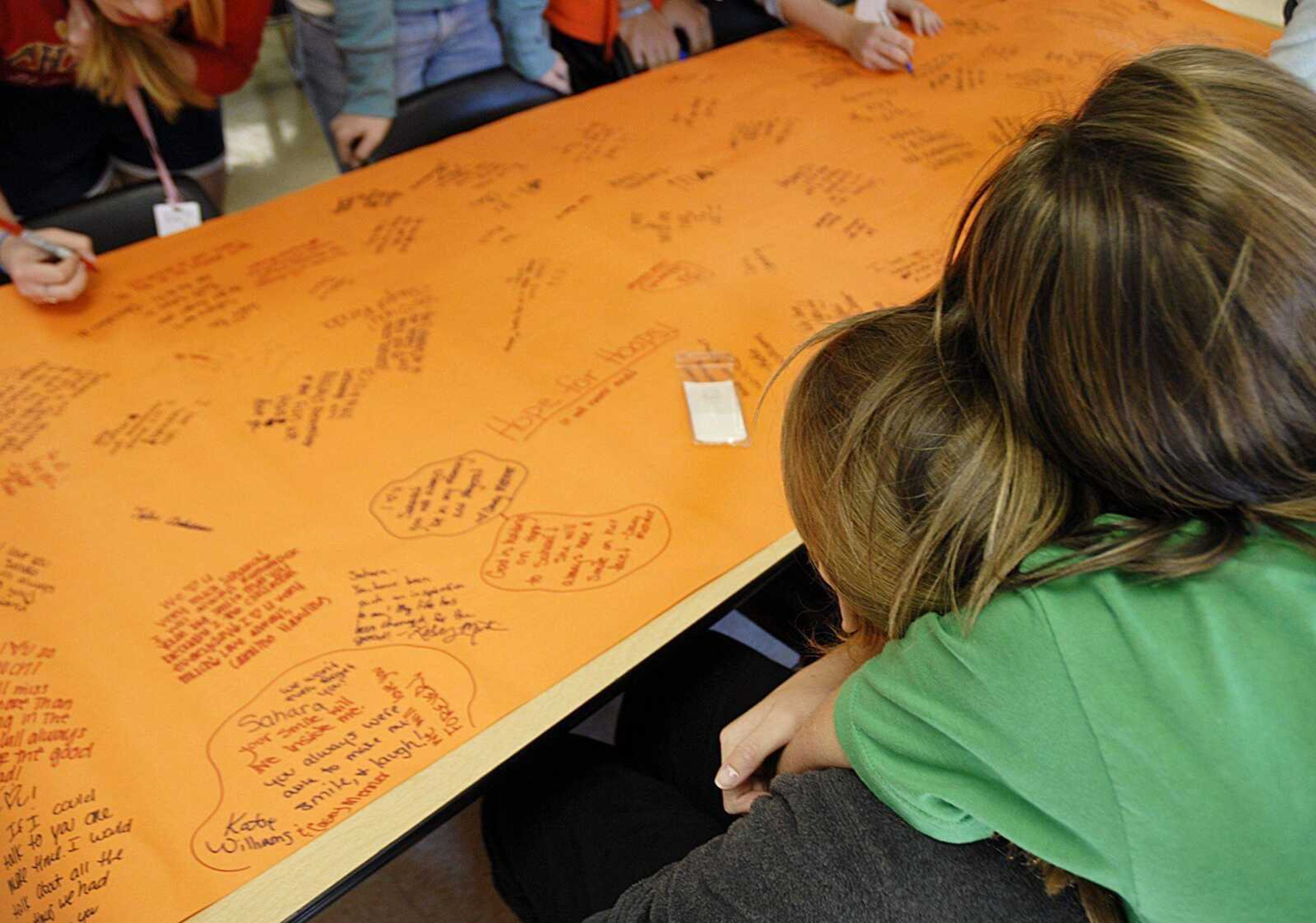 Following the loss of 13-year-old Sahara Aldridge, one student consoles another during a banner signing on Tuesday, November 6, 2007 at Cape Jr. High School. (Aaron Eisenhauer)