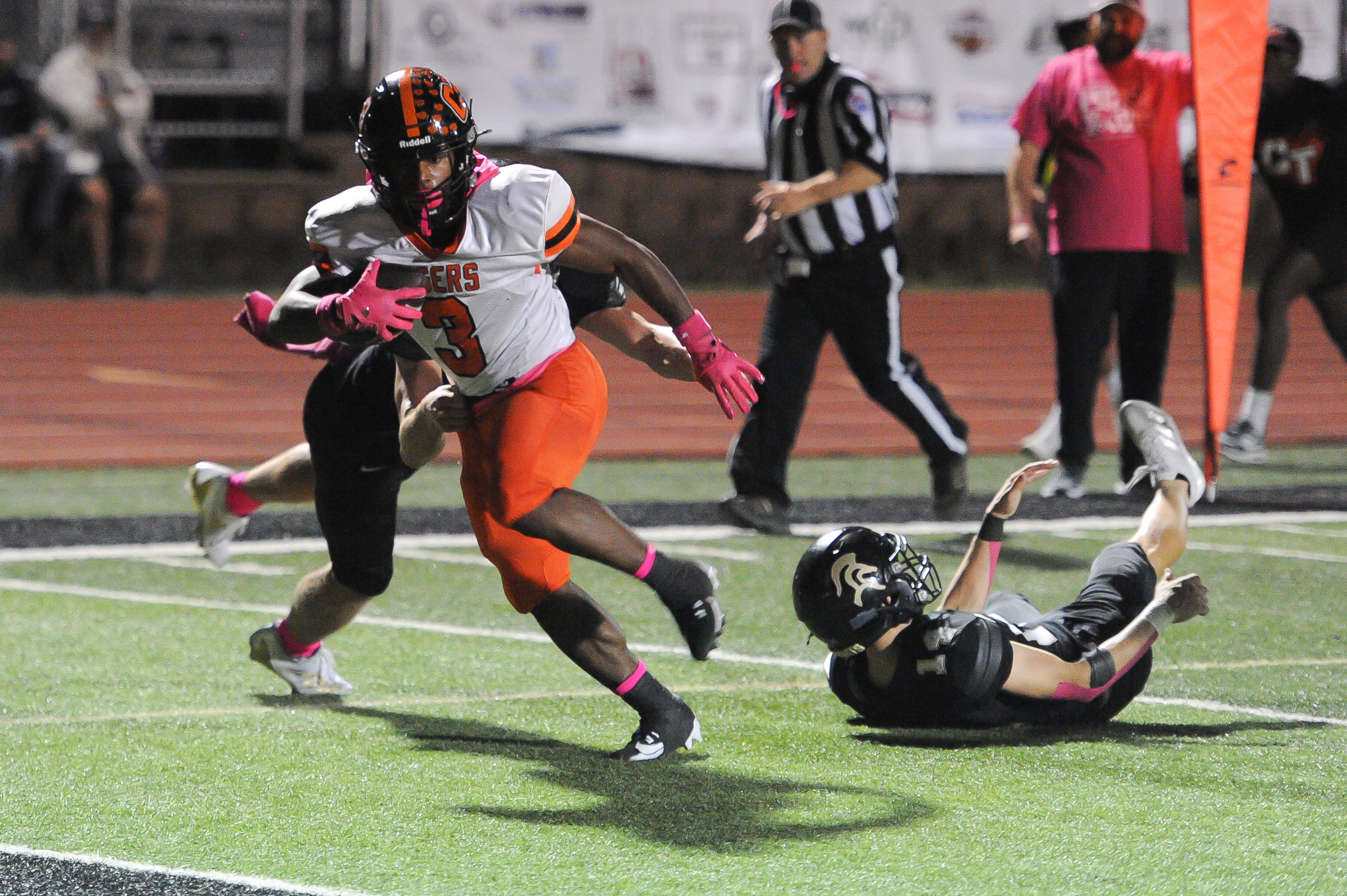 Cape Central’s Zai’Aire Thomas shakes a pair of Farmington defenders to score during a game between the Farmington Knights and the Cape Central Tigers on Friday, Oct. 11, at Farmington High School in Farmington.