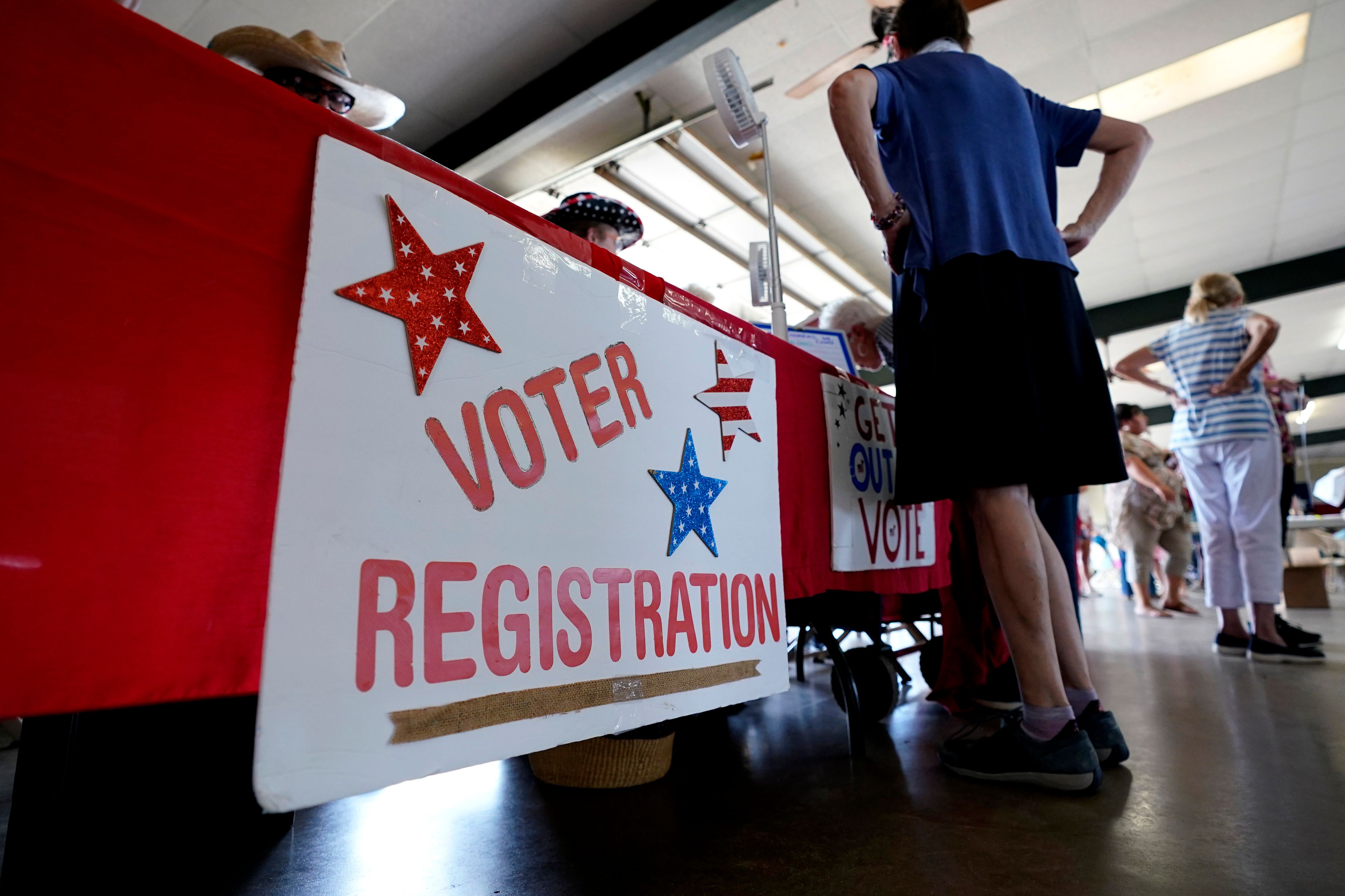 FILE - A voter registration table is seen at a political event for Texas gubernatorial candidate Beto O'Rourke, Wednesday, Aug. 17, 2022, in Fredericksburg, Texas. (AP Photo/Eric Gay, File)