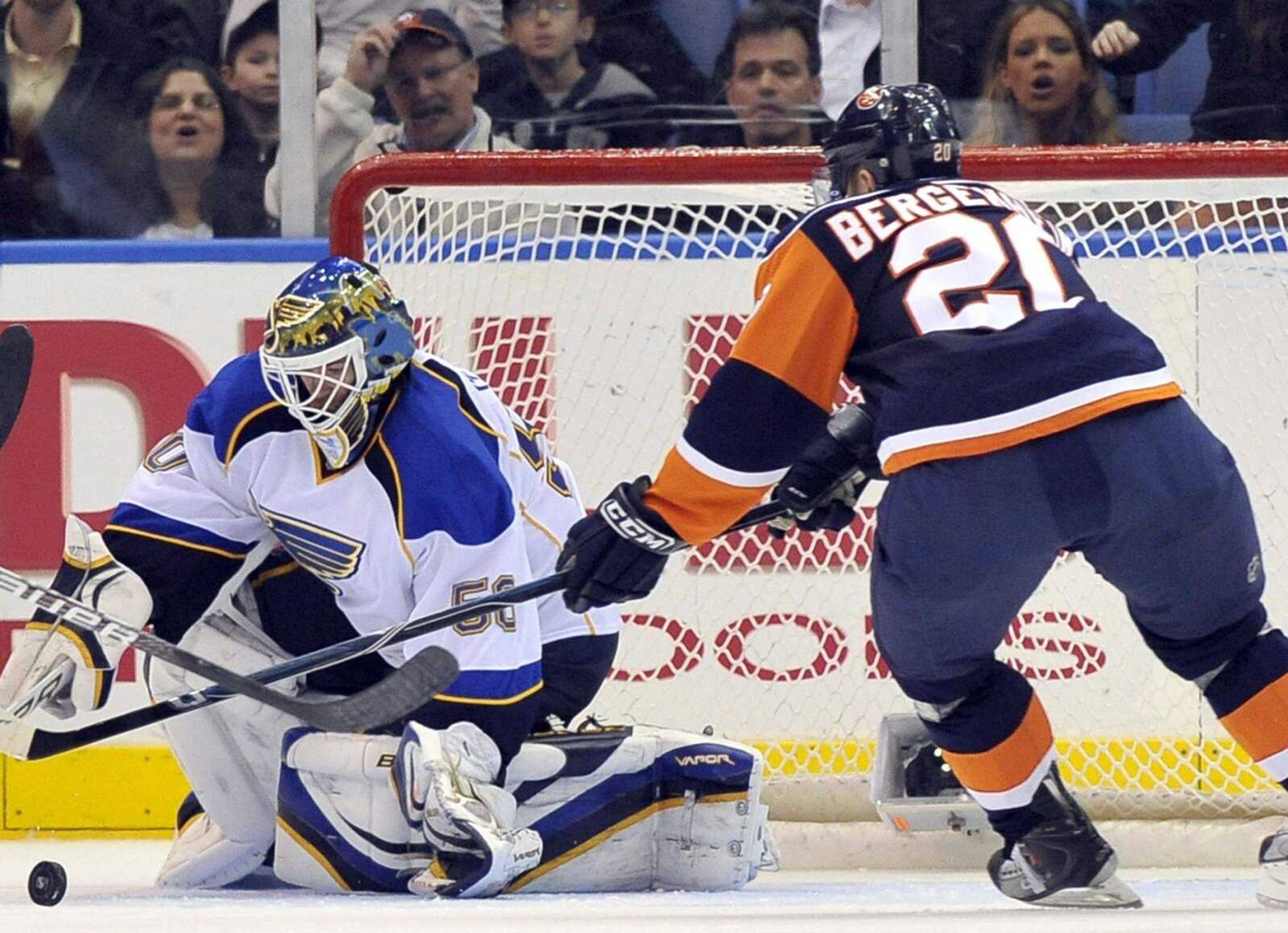 Blues goalie Chris Mason blocks a shot by Islanders forward Sean Bergenheim during their game earlier this month in Uniondale, N.Y. (KATHY KMONICEK ~ Associated Press)