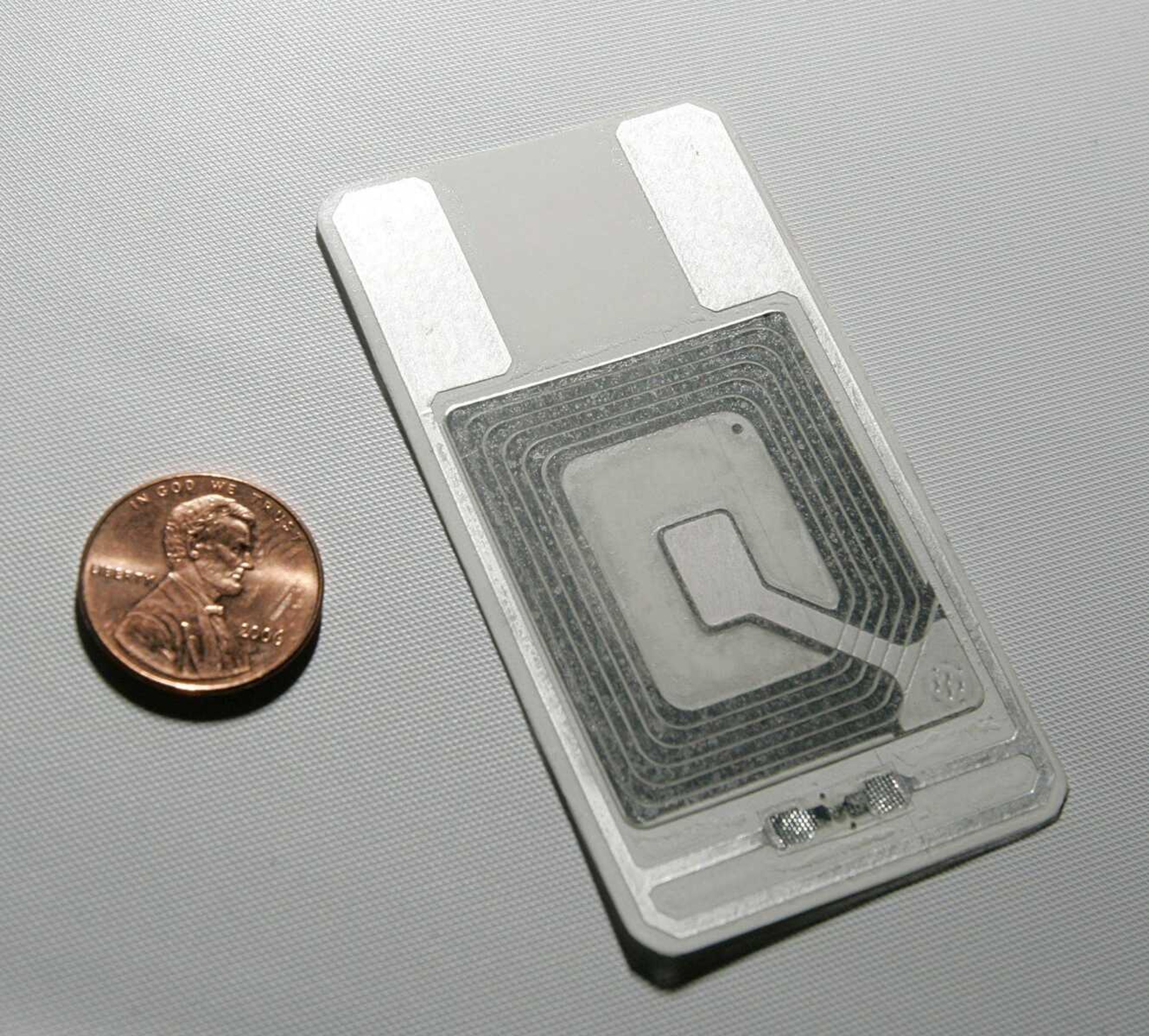 A radio-frequency identification chip (RFID) that can be used in many applications, such as identification tags, was displayed May 1 at the RFID convention at the Coronado Springs Resort and Convention Center in Lake Buena Vista, Fla. (JOHN RAOUX ~ Associated Press)