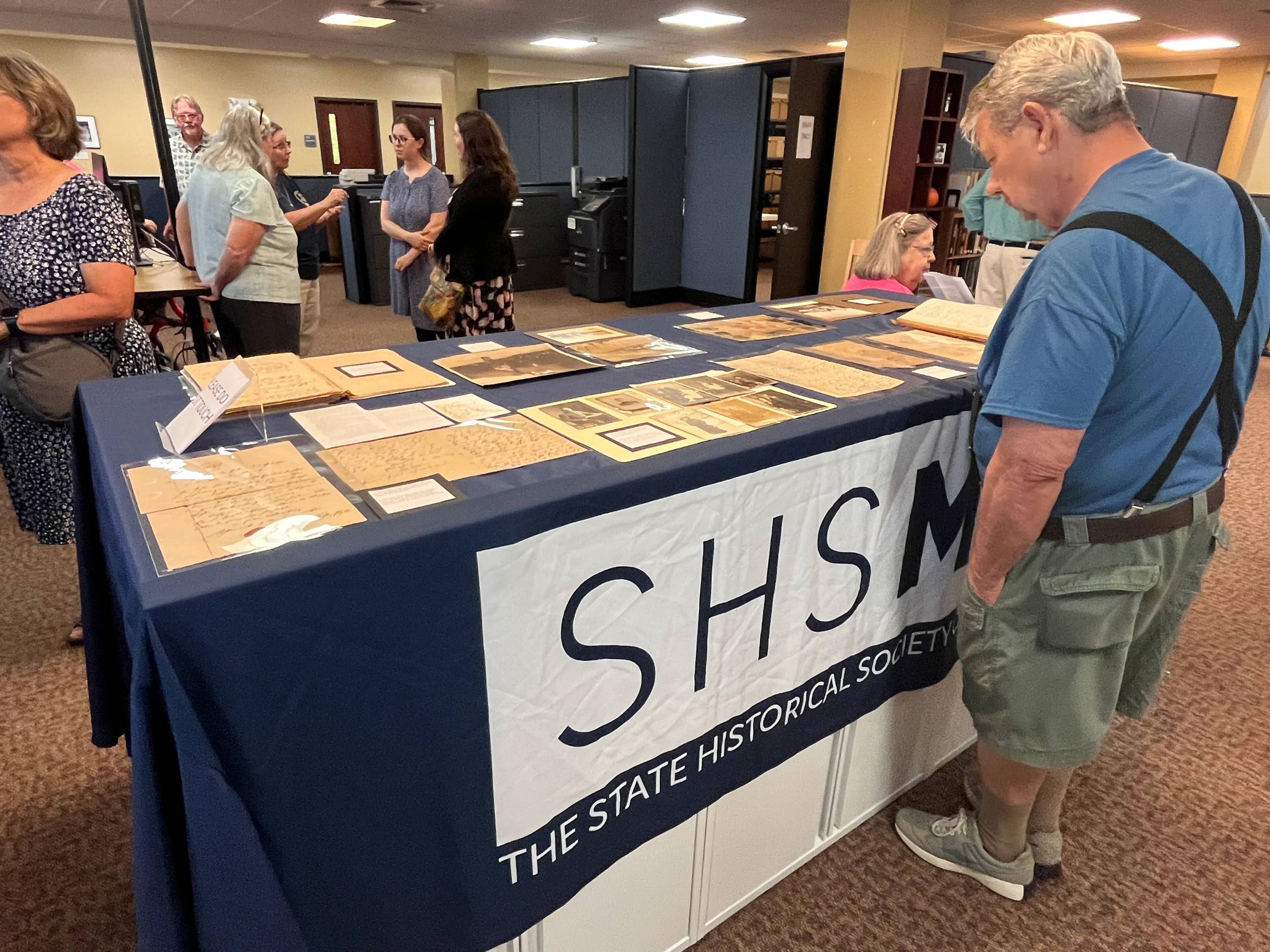 Guests socialize and view displays during the State Historical Society of Missouri's open house unveiling of its new Cape Girardeau Research Center on Aug. 27 at Kent Library on Southeast Missouri State University's campus is Cape Girardeau.