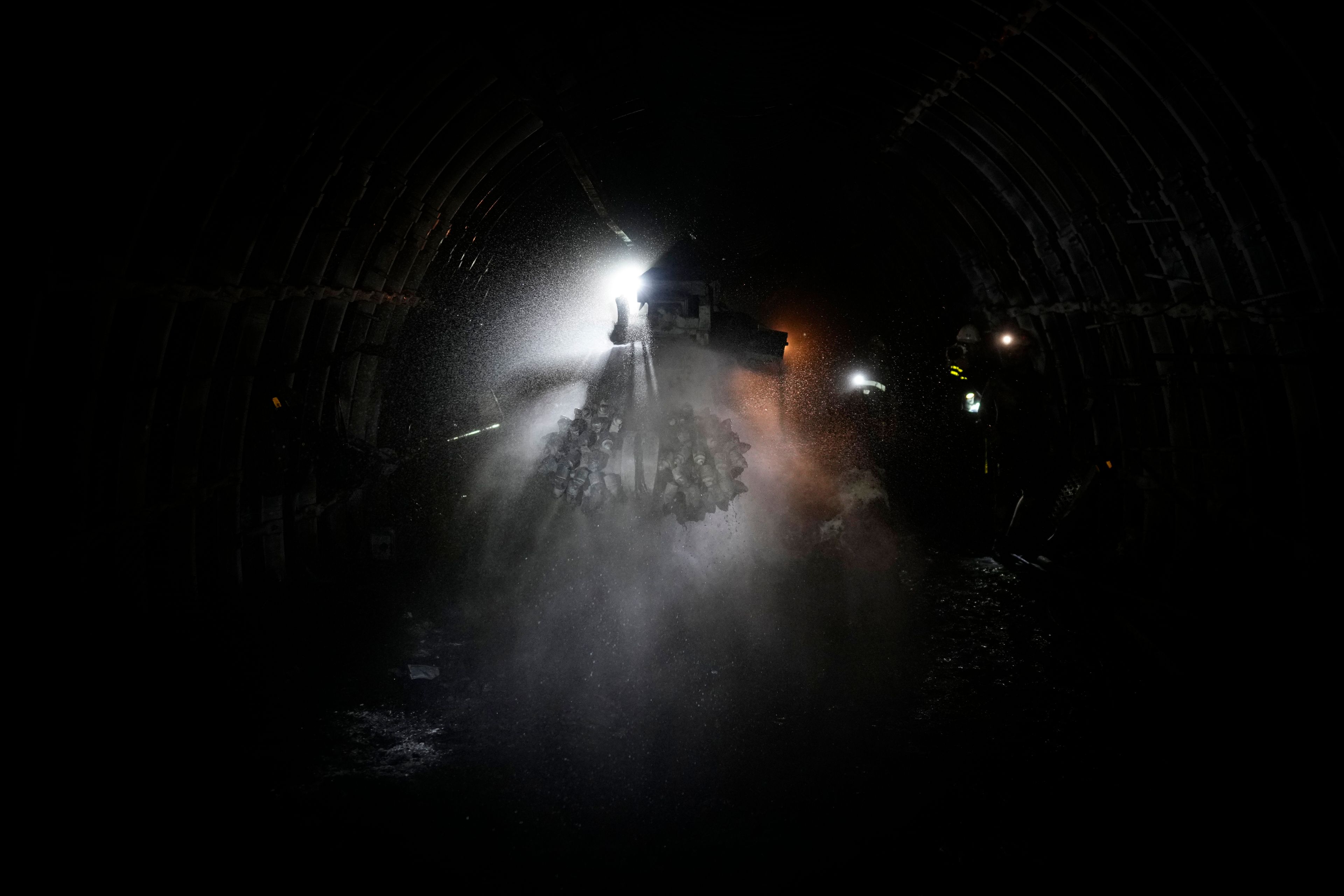 A drill sprays water in a shaft of the CSM coal mine in Stonava, Czech Republic, Monday, Oct. 14, 2024. (AP Photo/Petr David Josek)