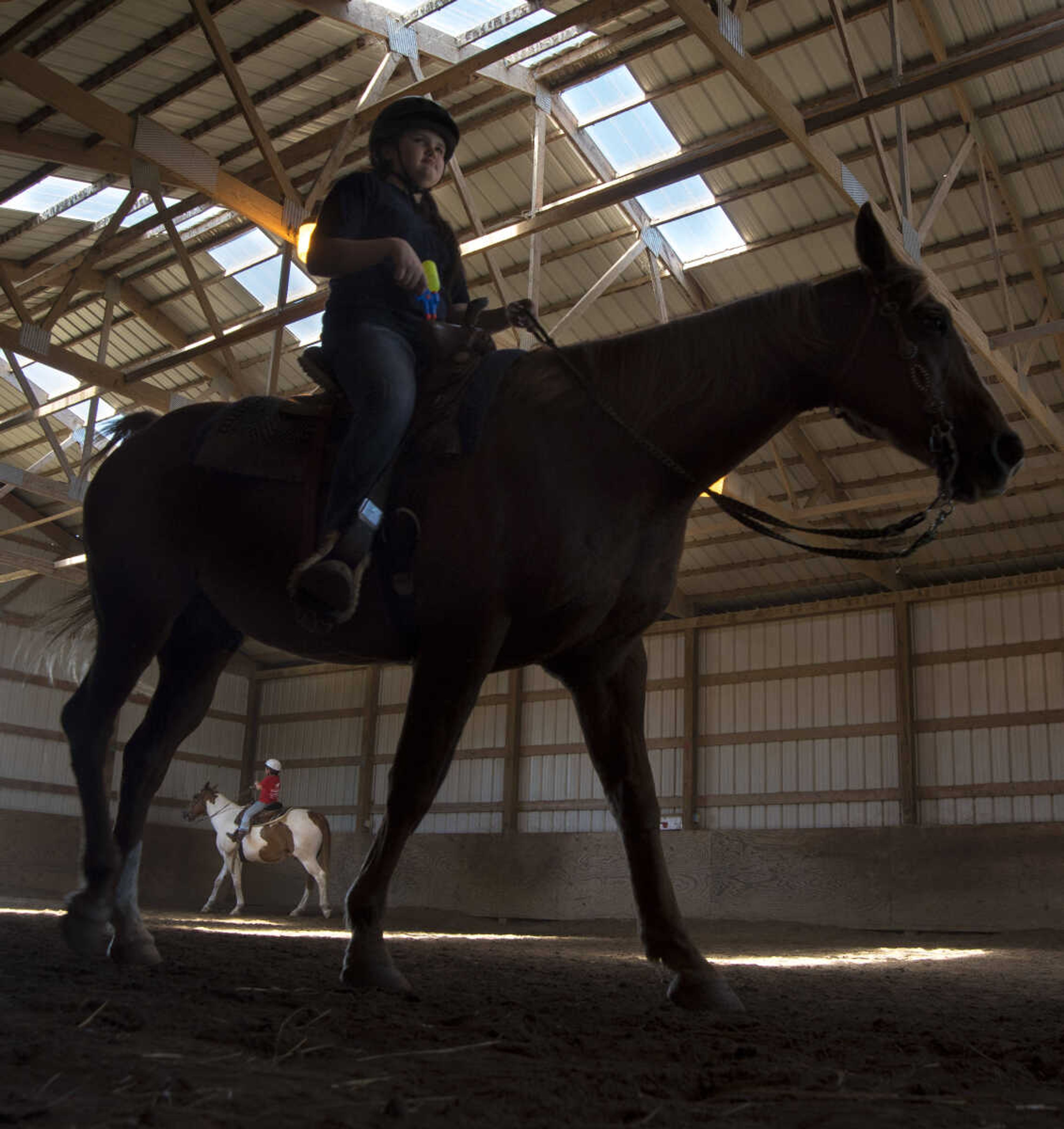 Emma Smith, 12, rides Max the horse during the Rolling Hills Youth Day Camp Wednesday, June 7, 2017 in Cape Girardeau.