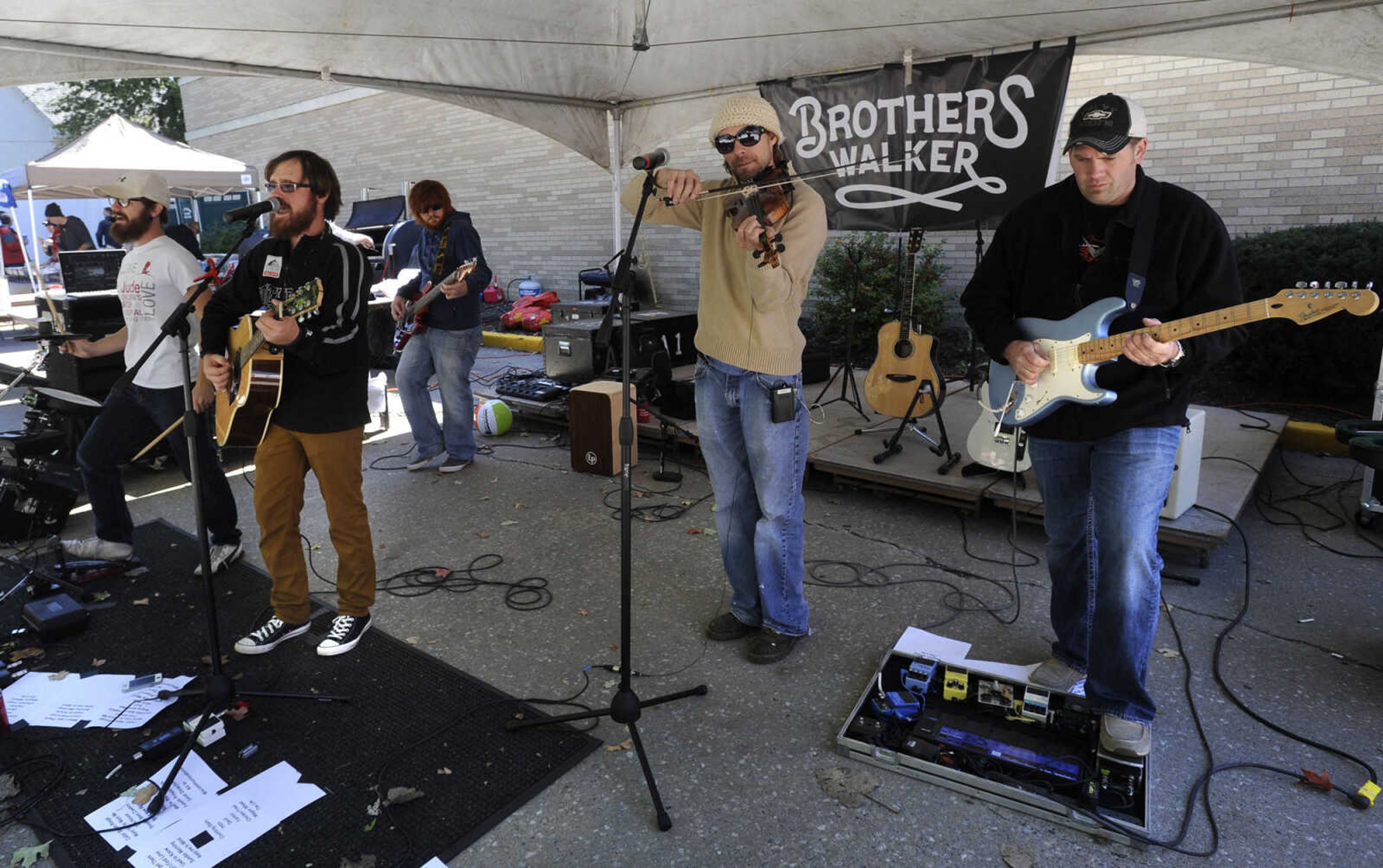 FRED LYNCH ~ flynch@semissourian.com
The Brothers Walker of Bernie, Missouri entertain at a homecoming tailgate for Southeast Missouri State University on Saturday, Oct. 4, 2014 in Cape Girardeau.