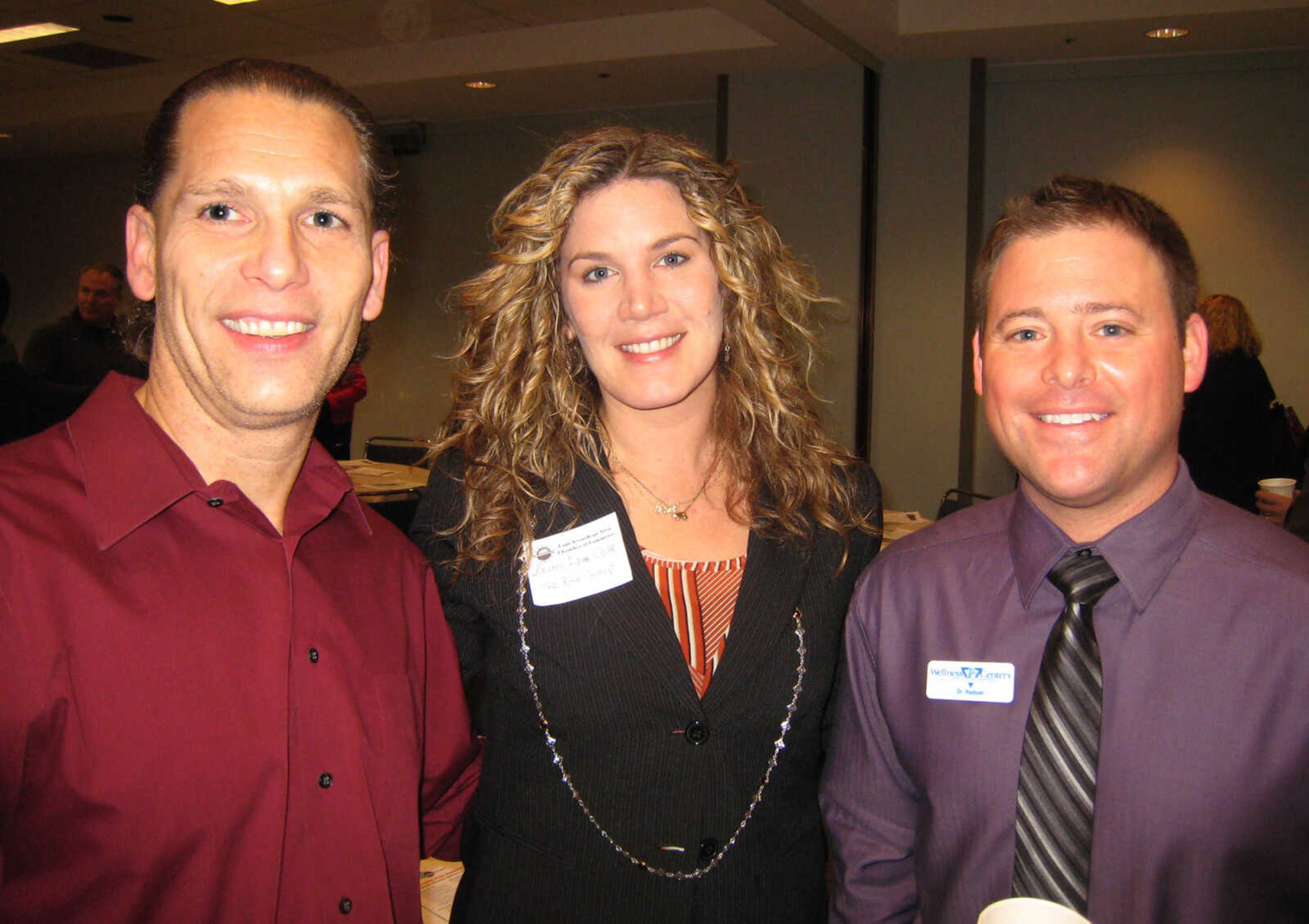 Scott Pietreface, Fumatore di Sigaro, left, Lauren Anne Cole, The Rite Group, and Dr. Seth Hudson, PC Wellness Center, at the Cape Girardeau Area Chamber of Commerce First Friday Coffee, Feb. 1, at the Show Me Center.