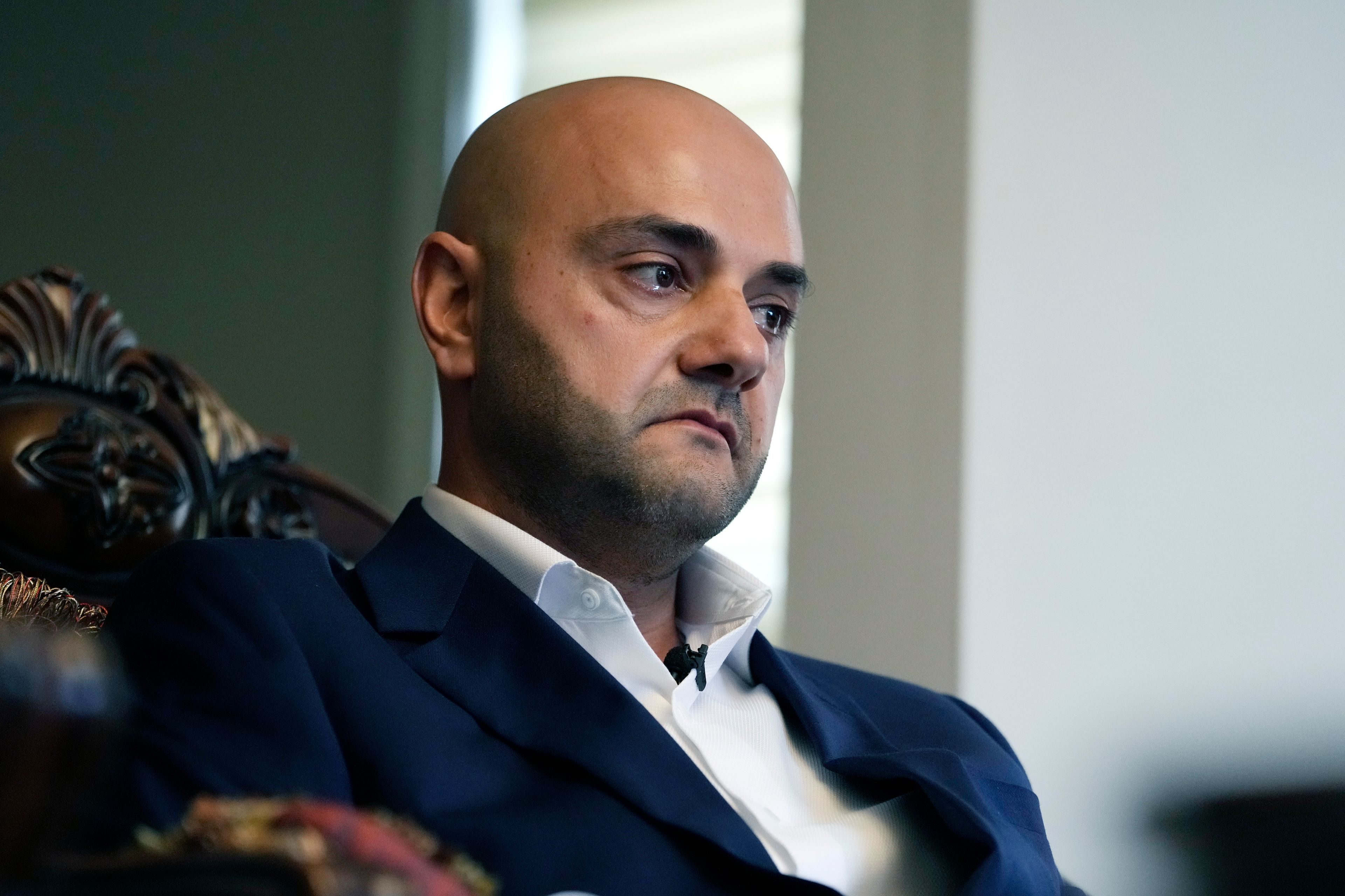 Assad Turfe, a Lebanese American and the deputy executive of Wayne County, recalls the detainment of his wife, during an interview, Oct. 23, 2024 in Dearborn, Mich. Turfe is among the few Arab American leaders in Michigan to have endorsed presidential candidate Kamala Harris. (AP Photo/Carlos Osorio)