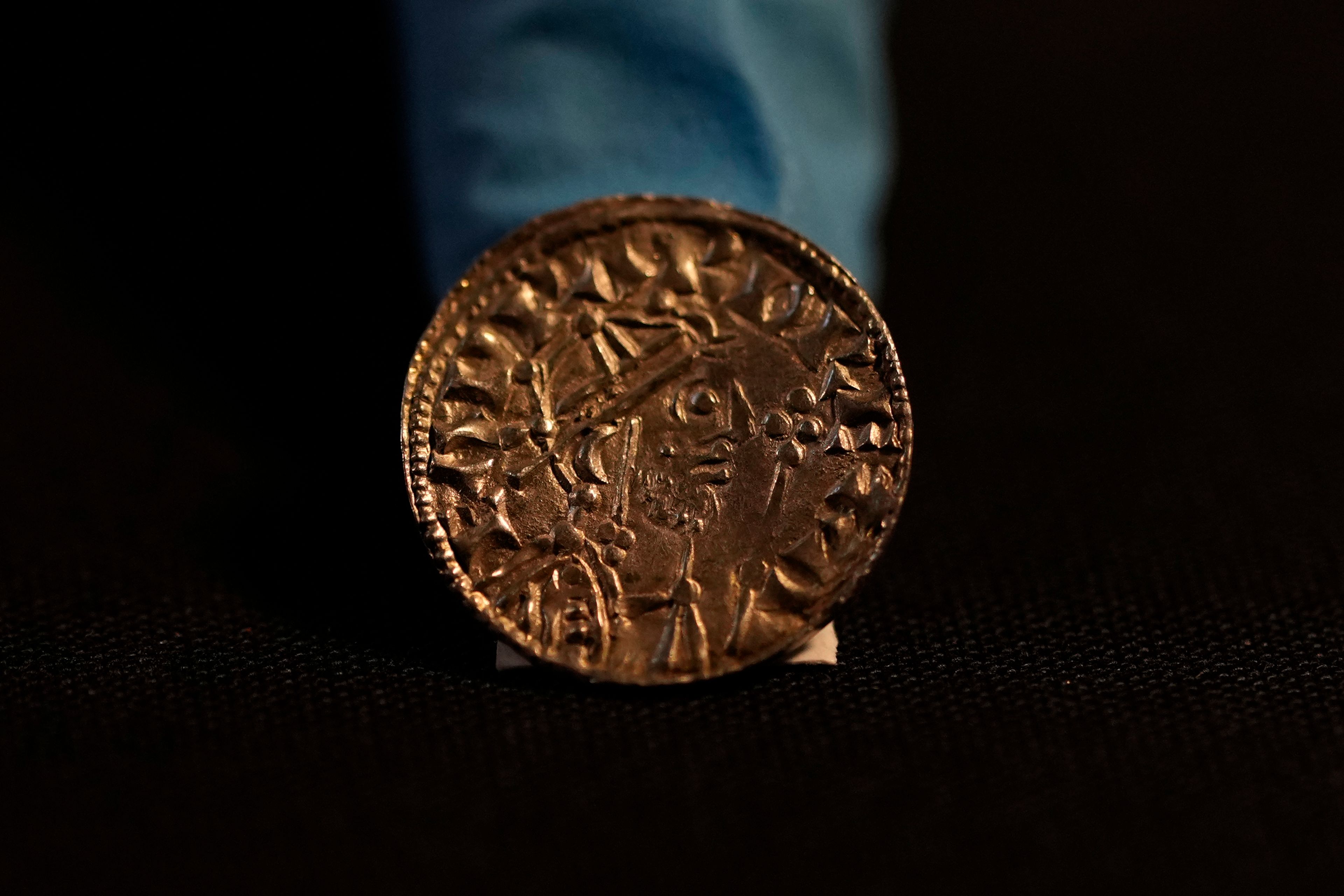 An Edward the Confessor Pyramid coin (1065-6), part of the Chew Valley Hoard of 2,584 coins, buried in the turmoil following the Norman Invasion of Britain in 1066, on display at the British Museum in London, Tuesday, Oct. 22, 2024, the hoard is valued at £4.3 million pounds, (US$5.58 million), a record find. (AP Photo/Alastair Grant)