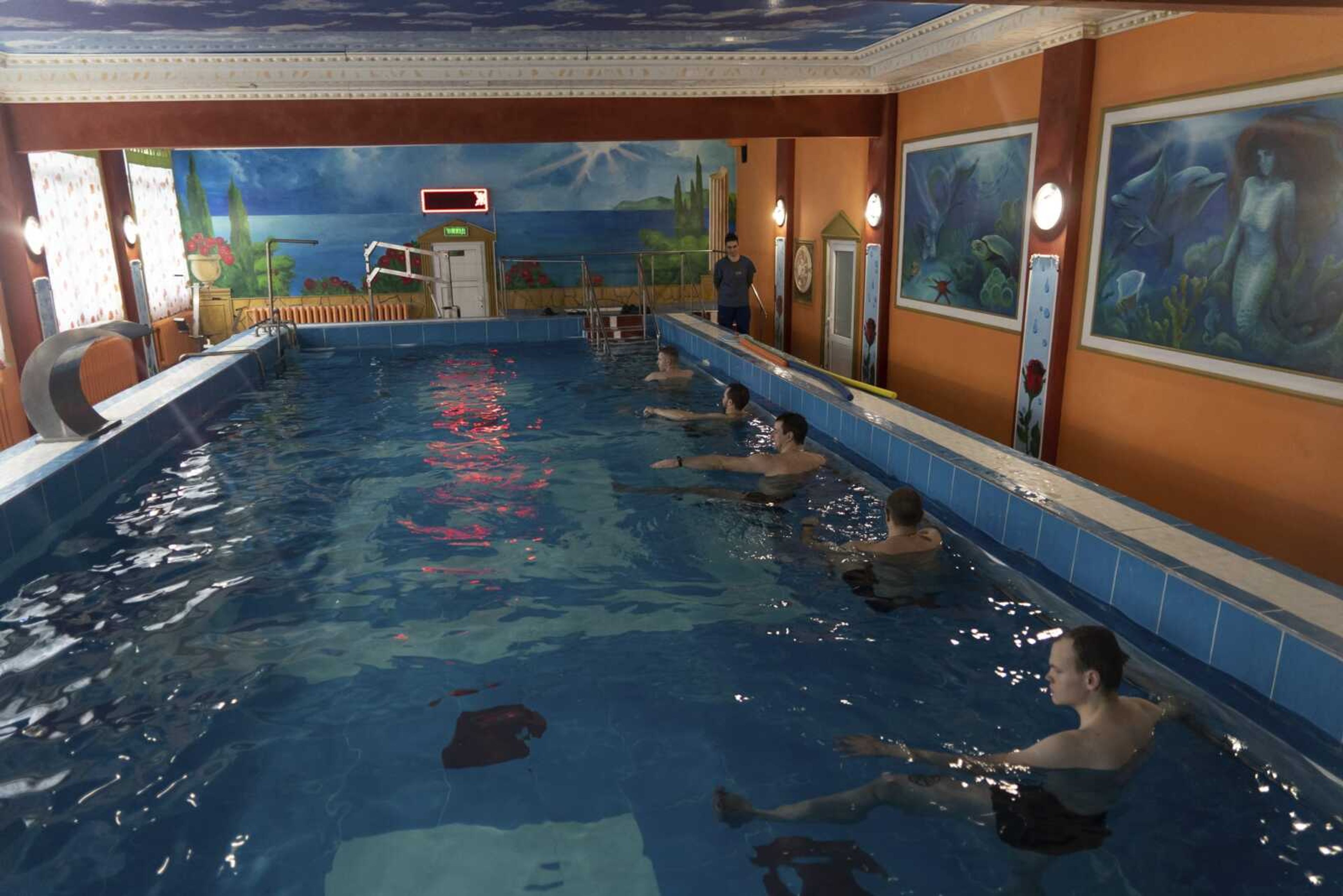 Ukrainian soldier take part in an aquatic therapy session in a hot pool Dec. 30 at a rehabilitation center in Kharkiv region, Ukraine.