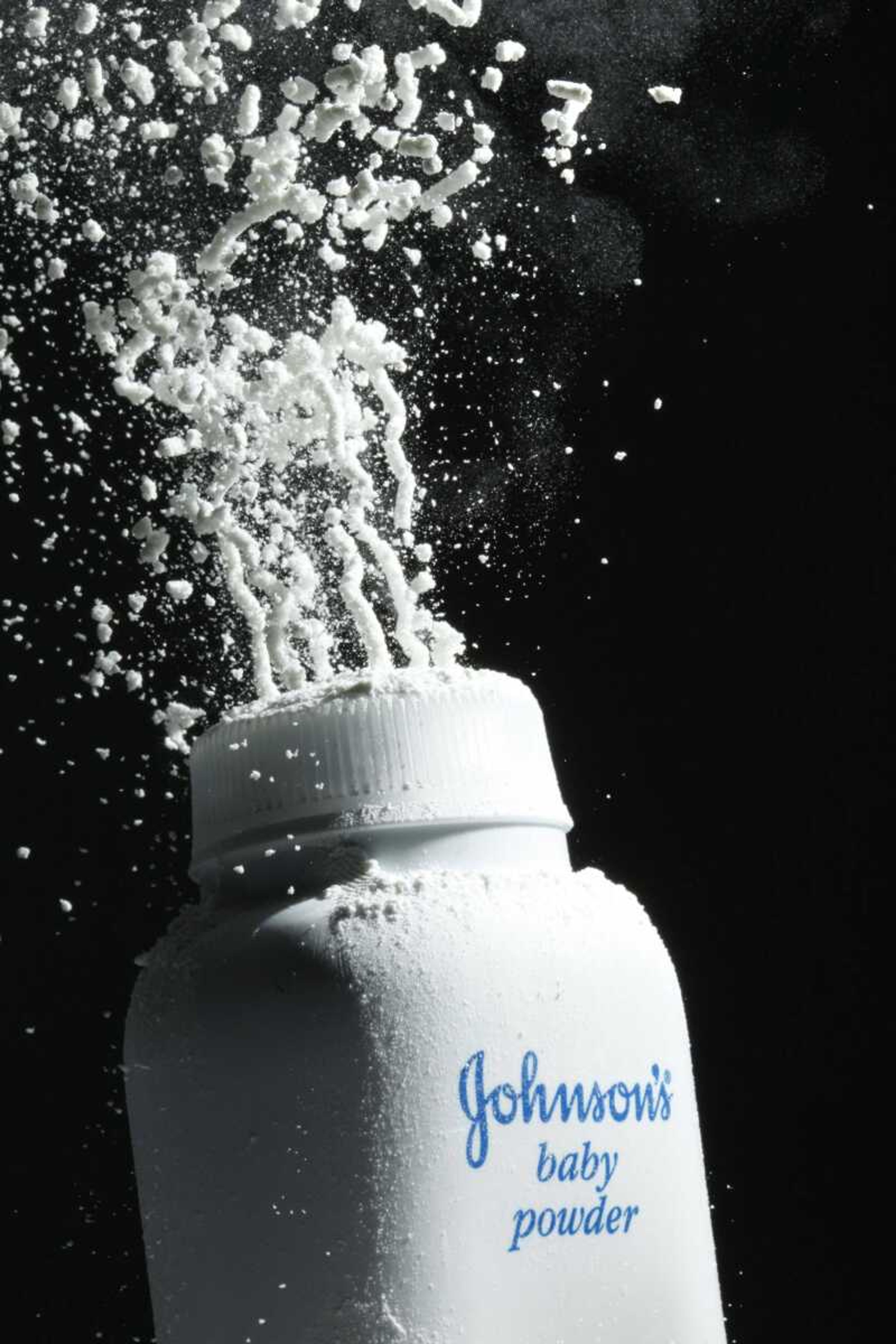 Johnson's baby powder is squeezed from its container. On Monday, a Los Angeles County Superior Court  jury ordered Johnson & Johnson to pay $417 million in a case to a woman who claimed in a lawsuit the talc in the company's baby powder causes ovarian cancer.