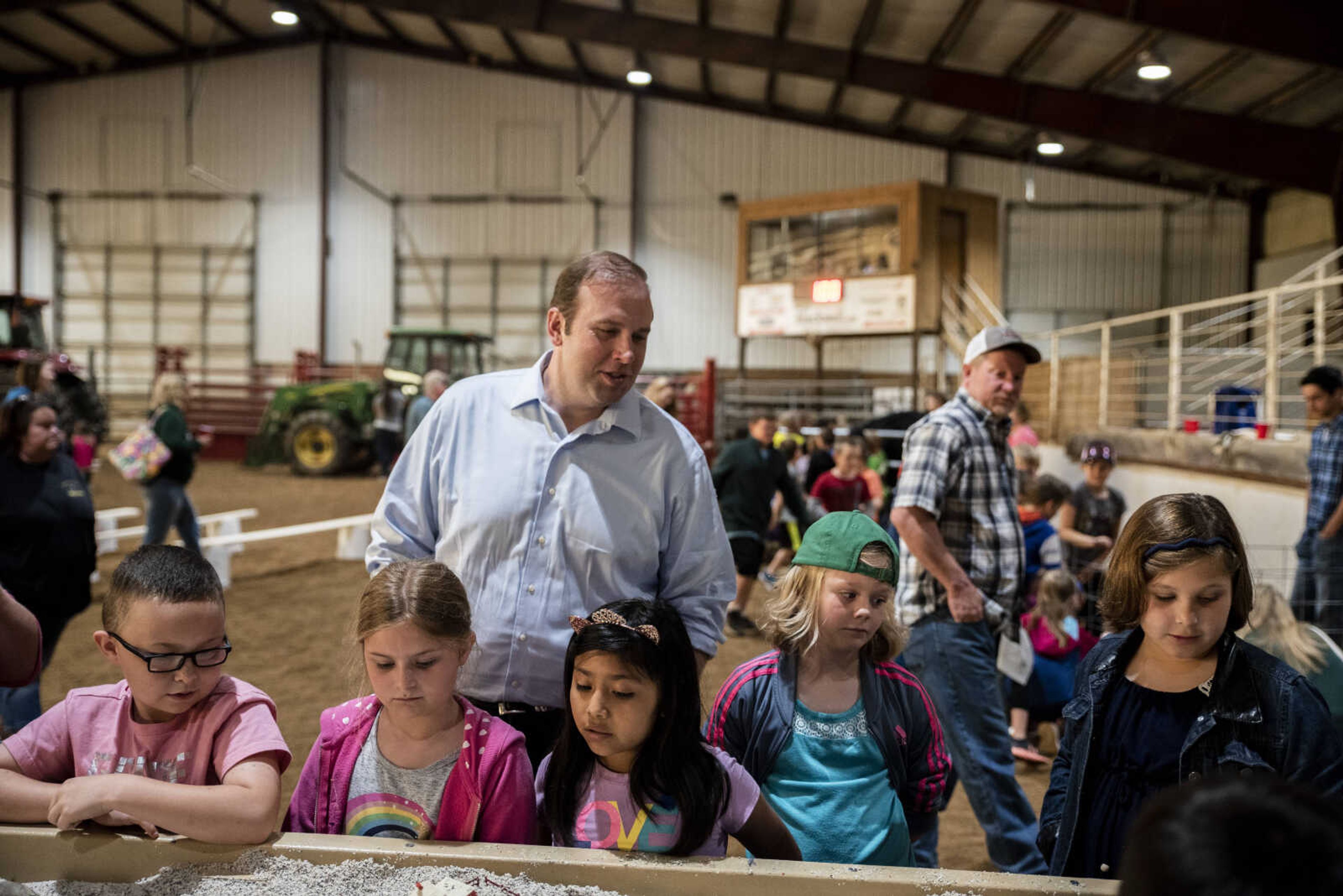 U.S. Rep. Jason Smith, R-Salem, Missouri, watches a stream table demonstration with a second grade class from Perryville during the 24th annual Farm Day sponsored by the Southeast Missouri Cattlemen's Association at Flickerwood Arena Wednesday, April 24, 2019, in Jackson. Over 800 students attended Farm Day and learned about a variety of farm-related topics from forestry to soil conservation, as well as farm animals and honey bees.