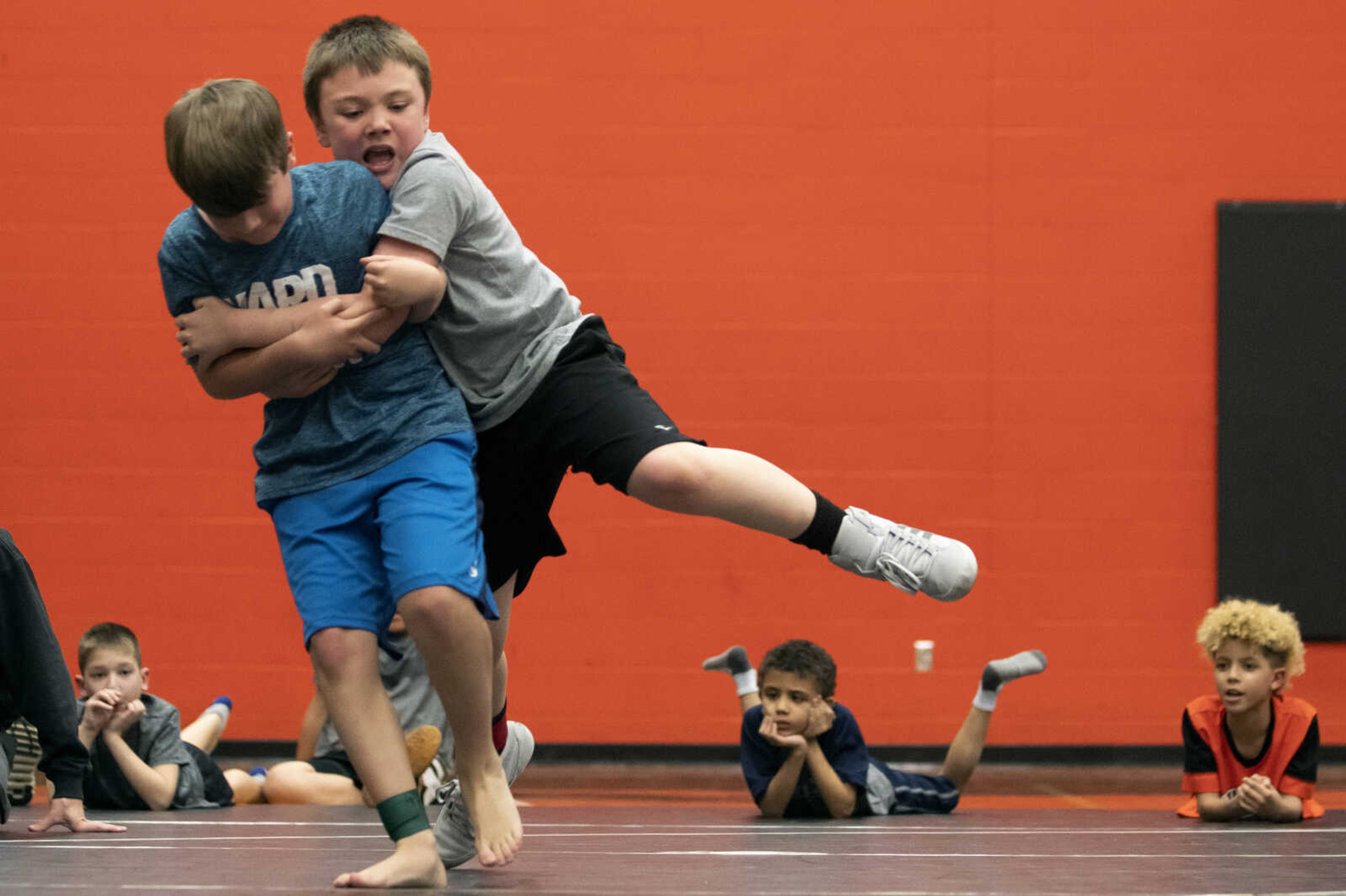 Joseph Baker, left, and Kaden Lamb, both 8 and of Cape Girardeau, face off during a match Tuesday, March 19, 2019, at Cape Central High School.