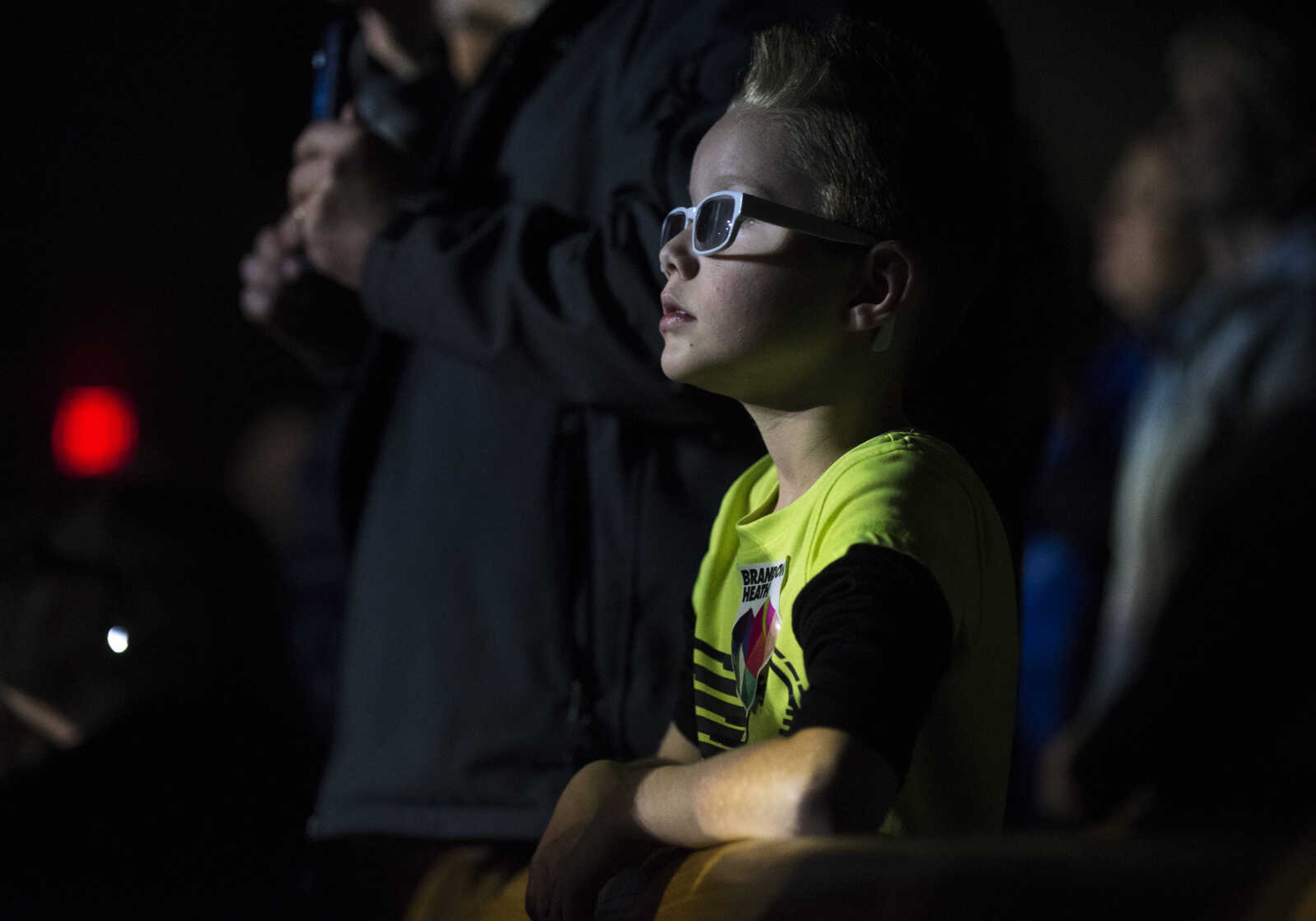 Stage lights illuminate the face of an audience member during a Big Daddy Weave concert Wednesday, March 14, 2018, at Cape Bible Chapel in Cape Girardeau.