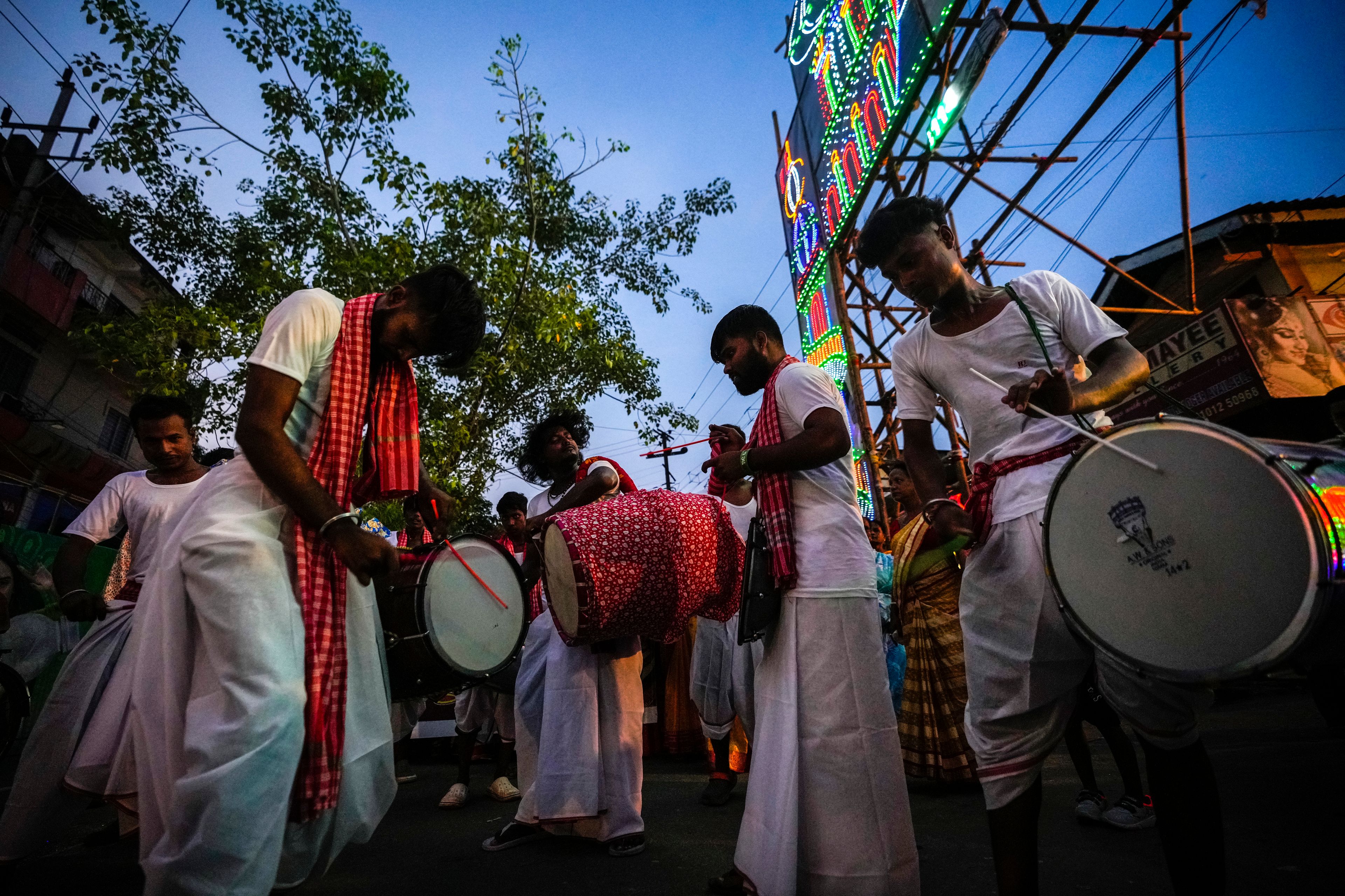 Hindu devotees carry out a ritual procession during the Durga Puja festival in Guwahati, India, Tuesday, Oct. 8, 2024. (AP Photo/Anupam Nath)