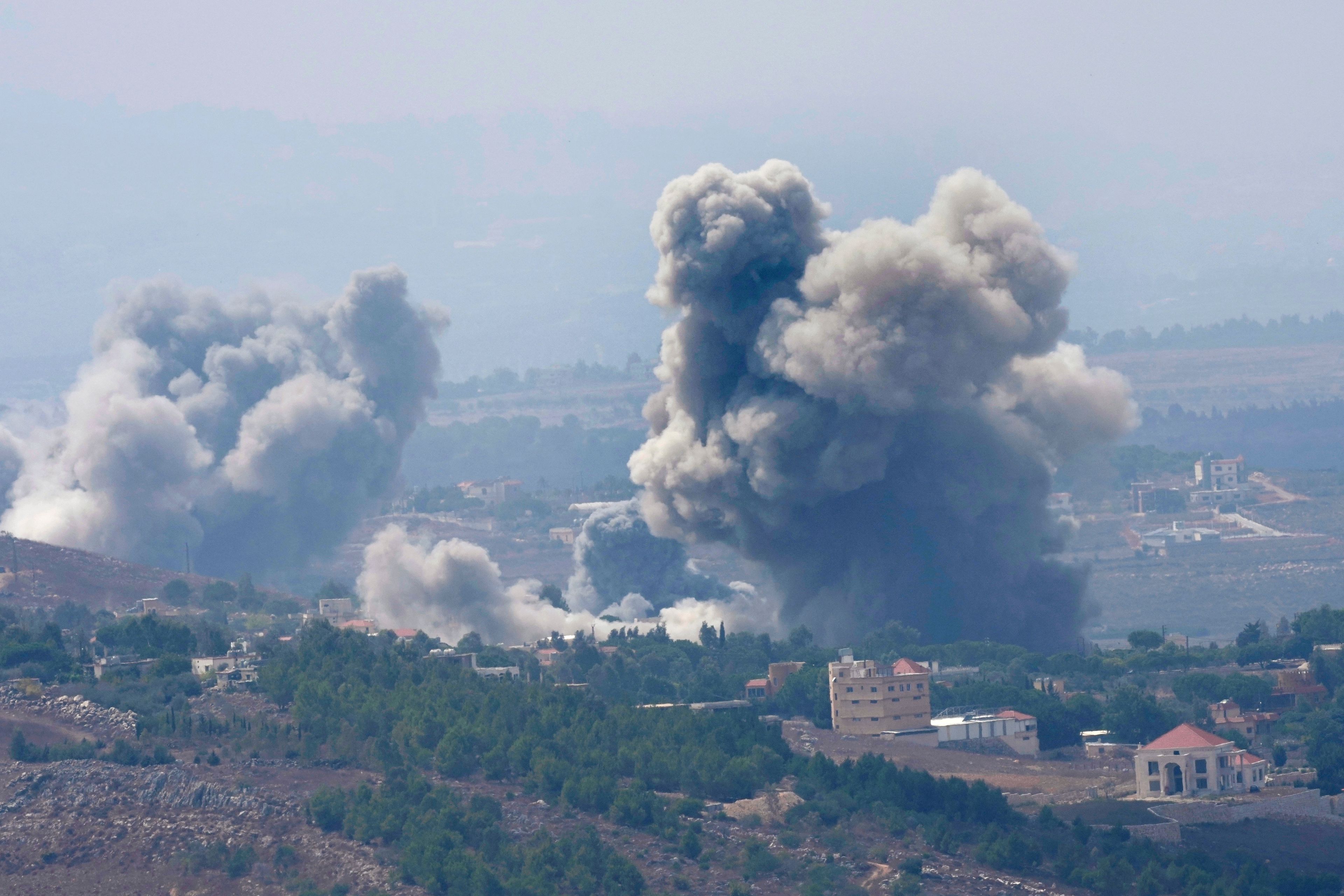 Smoke rises from Israeli airstrikes on villages in the Nabatiyeh district, seen from the southern town of Marjayoun, Lebanon, Monday, Sept. 23, 2024. (AP Photo/Hussein Malla)