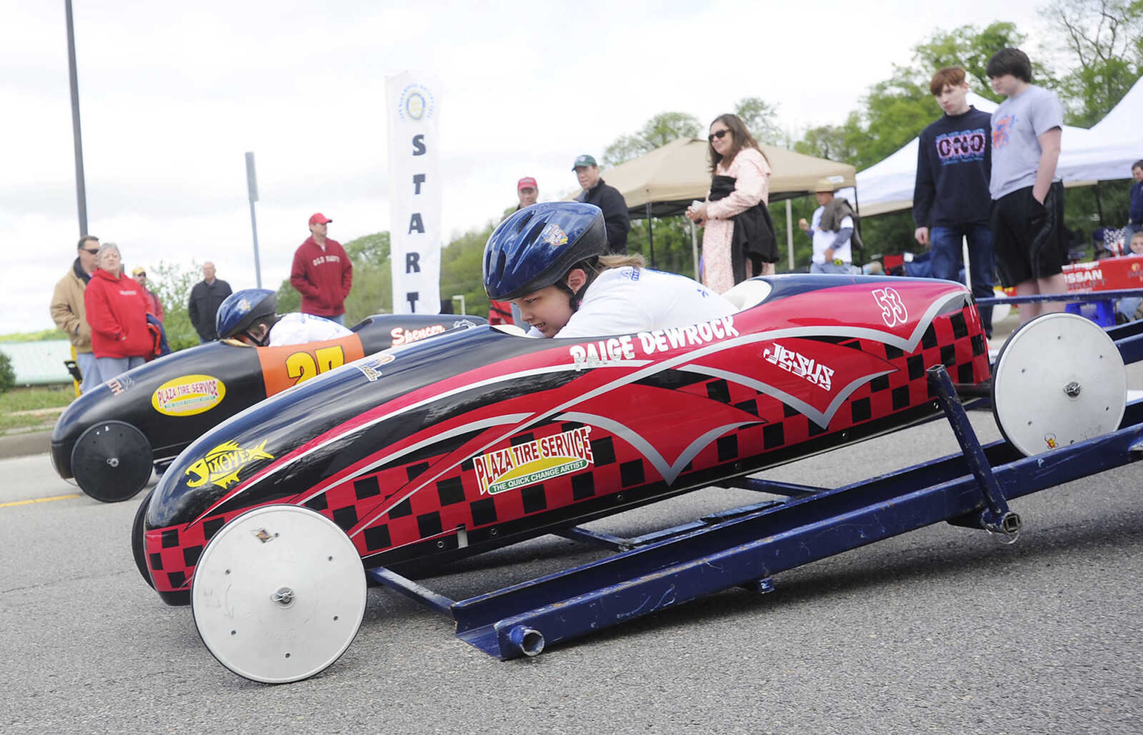 Spencer Mitten, 13, left, and Paige Dewrock, 10, wait for the start of their race during the 2013 Soap Box Derby Saturday, May 4, at Blanchard Elementary School, 1829 N. Sprigg St., in Cape Girardeau. Racers ranging in age from 7 to 17 competed in two divisions at the event which is a fundraiser for the Cape Girardeau Rotary Club. The winners in each division will go on to compete in the All-American Soap Box Derby held in Akron, Ohio in July.