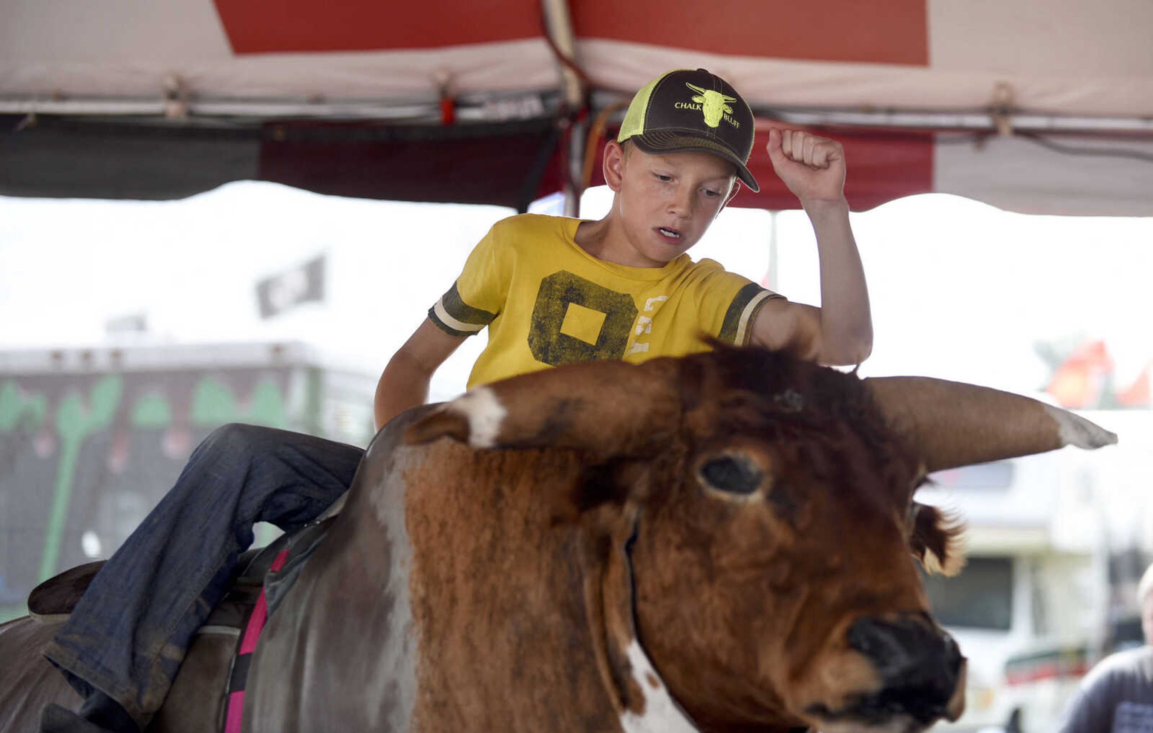 LAURA SIMON ~ lsimon@semissourian.com

People take a shot at the mechanical bull in the 8 Seconds Productions booth at the SEMO District Fair on Friday, Sept. 16, 2016, at Arena Park in Cape Girardeau.