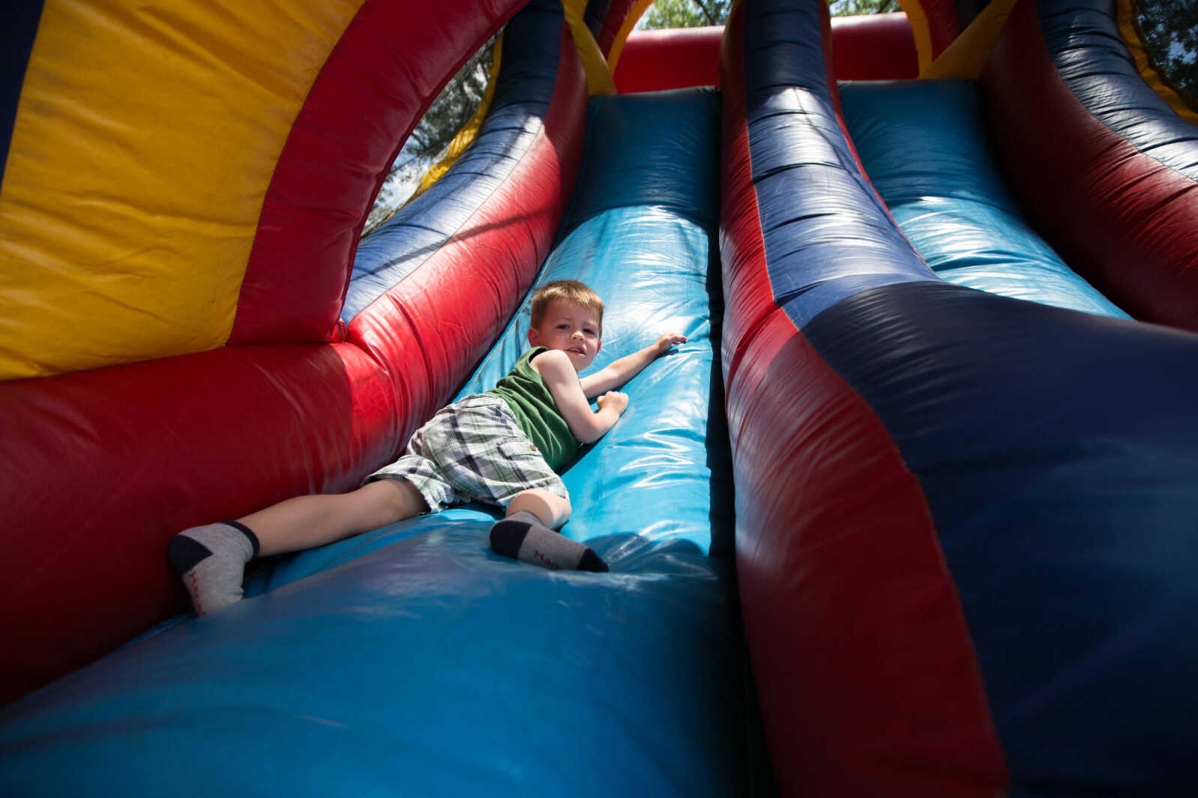 GLENN LANDBERG ~ glandberg@semissourian.com

Brady Larson Dobbins makes his way down an inflatable slide Saturday, June 18, 2016 at the River Campus Summer Arts Festival.