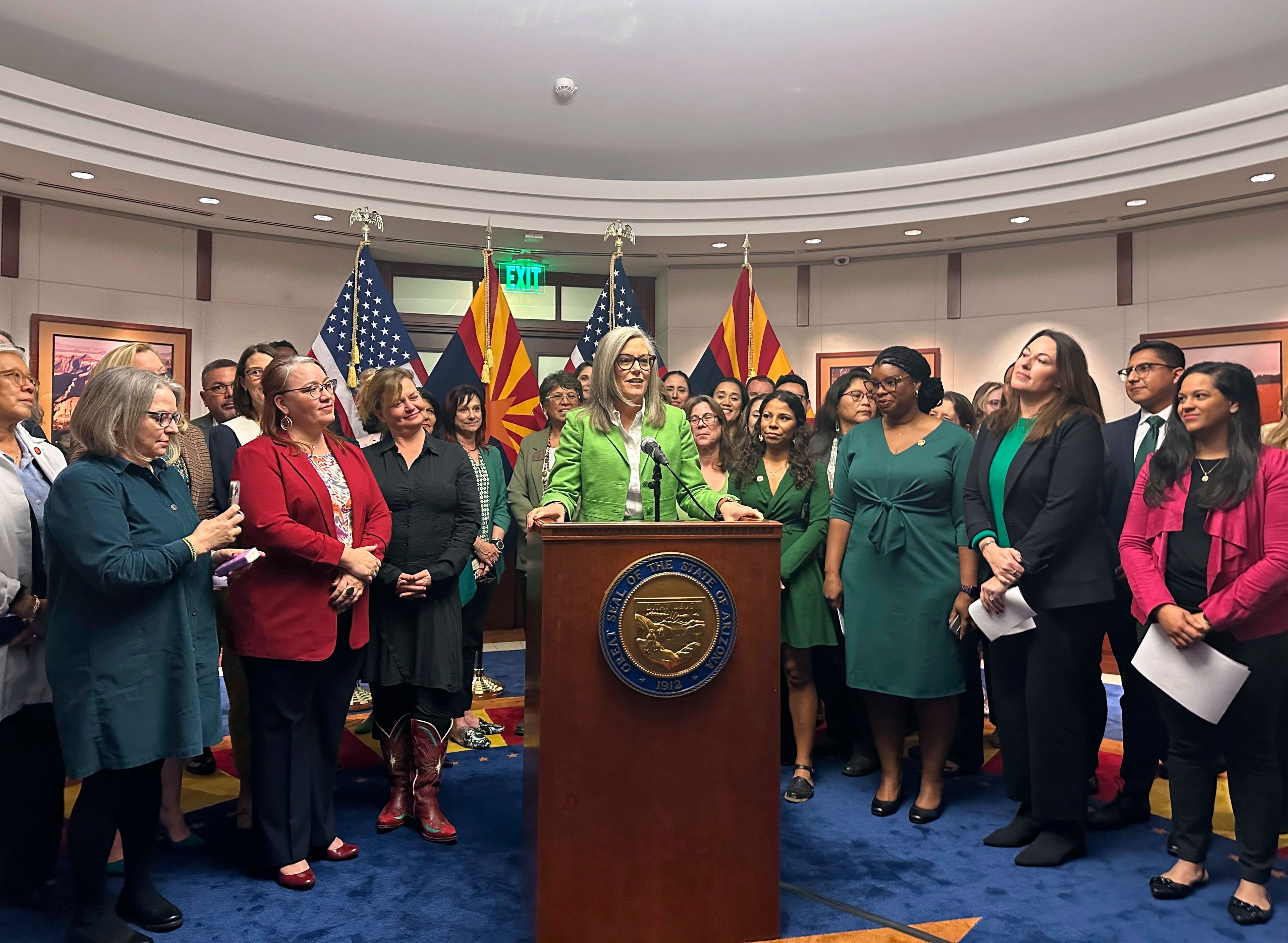 FILE - Arizona Gov. Katie Hobbs celebrates passages of abortion ballot measure surrounded by Democratic lawmakers and advocates on Nov. 25, 2024, at the State Capitol in Phoenix. (AP Photo/Sejal Govindarao, file)