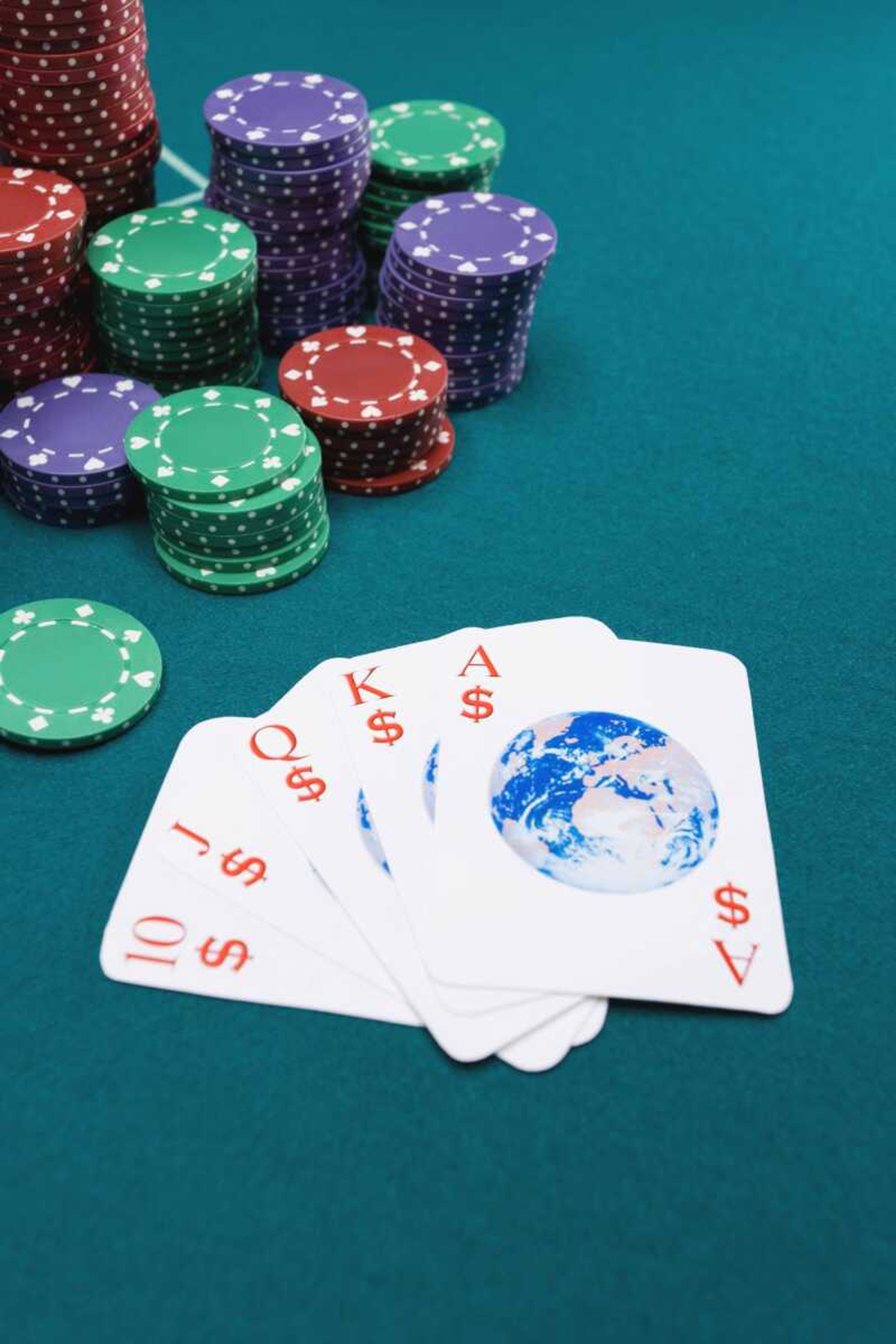 Globe playing cards with poker chips