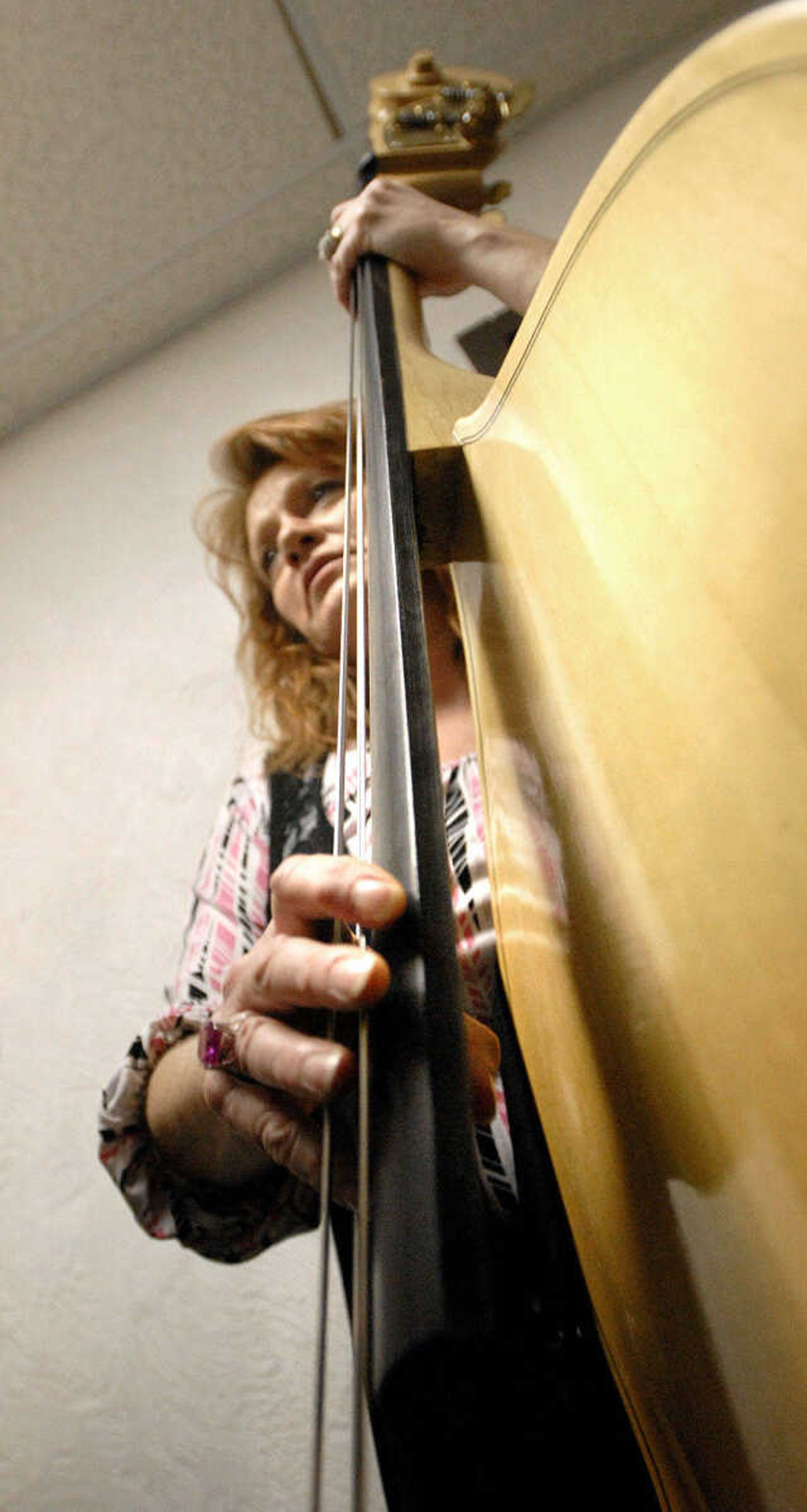 LAURA SIMON ~ lsimon@semissourian.com
Jeanne Lewis practices Thursday night, January 26, 2012 during the Bootheel Bluegrass Festival at the Bavarian Halle in Fruitland