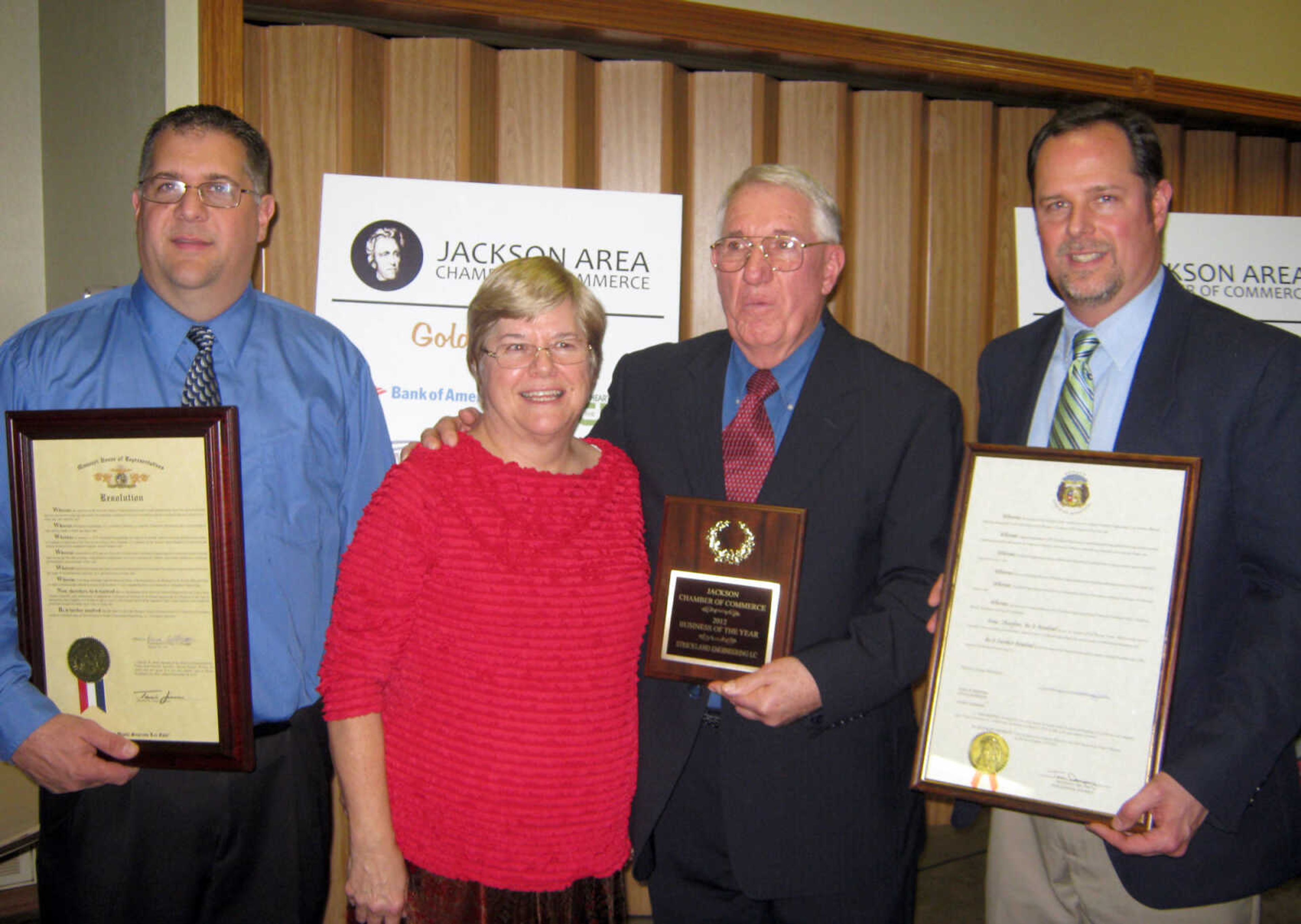 Brian Strickland, left, Judy Strickland, Tom Strickland and Mark Strickland receive the Small Business of the Year award for Strickland Engineering, Jan. 11, at the Jackson Area Chamber of Commerce annual awards banquet at the Knights of Columbus Hall in Jackson, Mo.