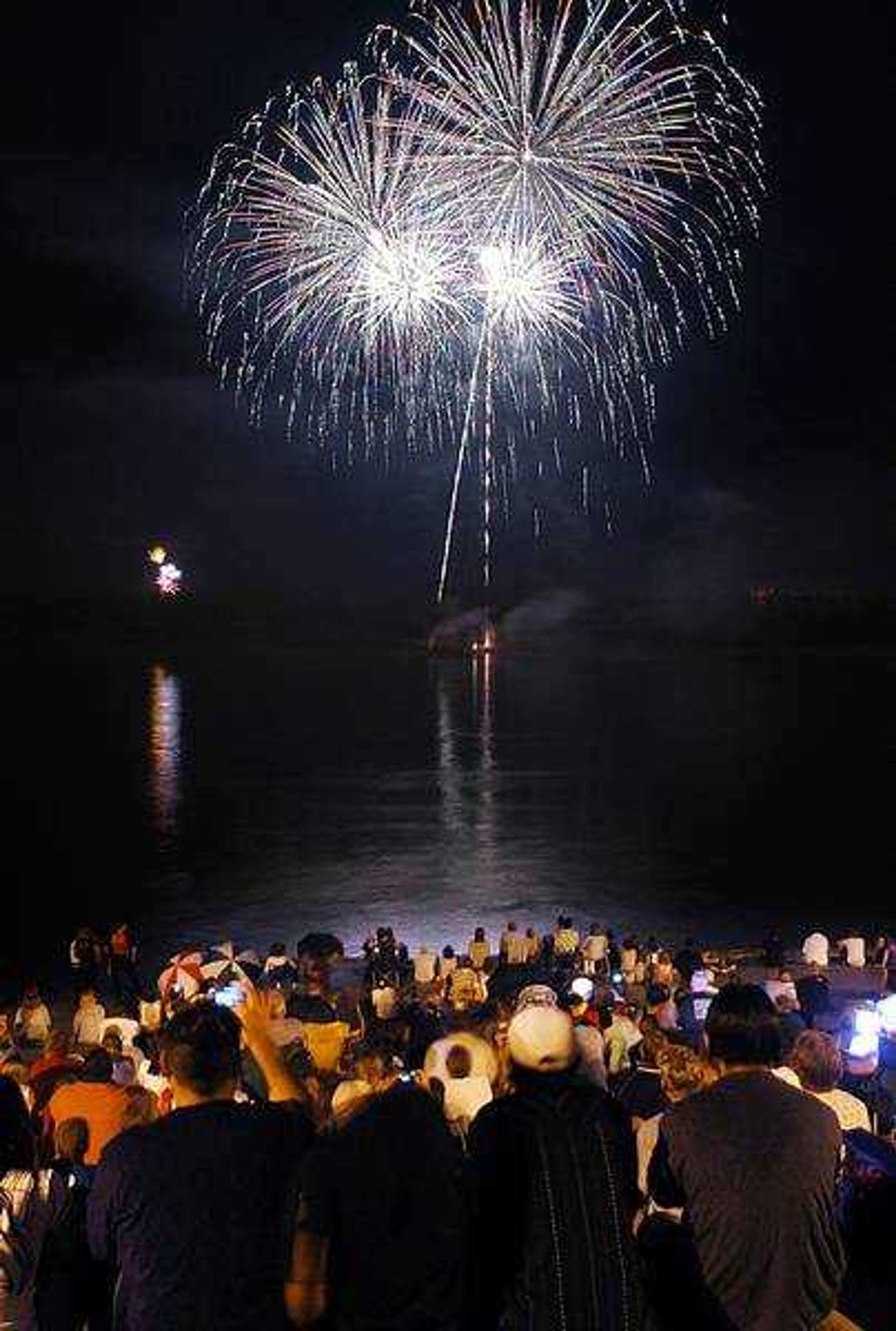 AARON EISENHAUER 
aeisenhauer@semissourian.com
Spectators crowded the Mississippi riverfront in Cape Girardeau to take in the fireworks during Libertyfest 2007.