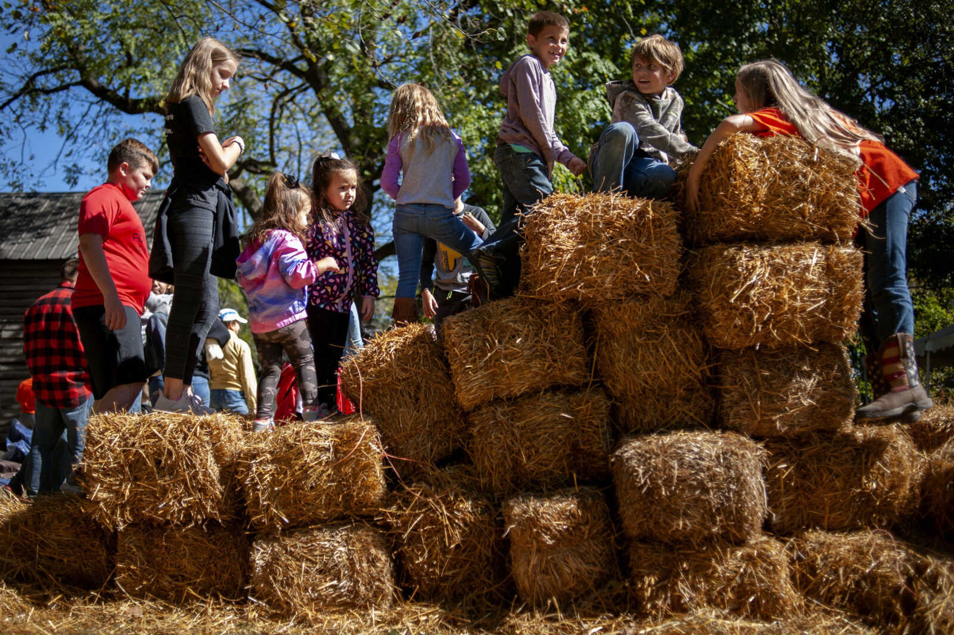 Children play on hay bales at the Saxon Lutheran Memorial's 39th annual Fall Festival on Saturday, Oct. 12, 2019, in Frohna, Missouri.&nbsp;