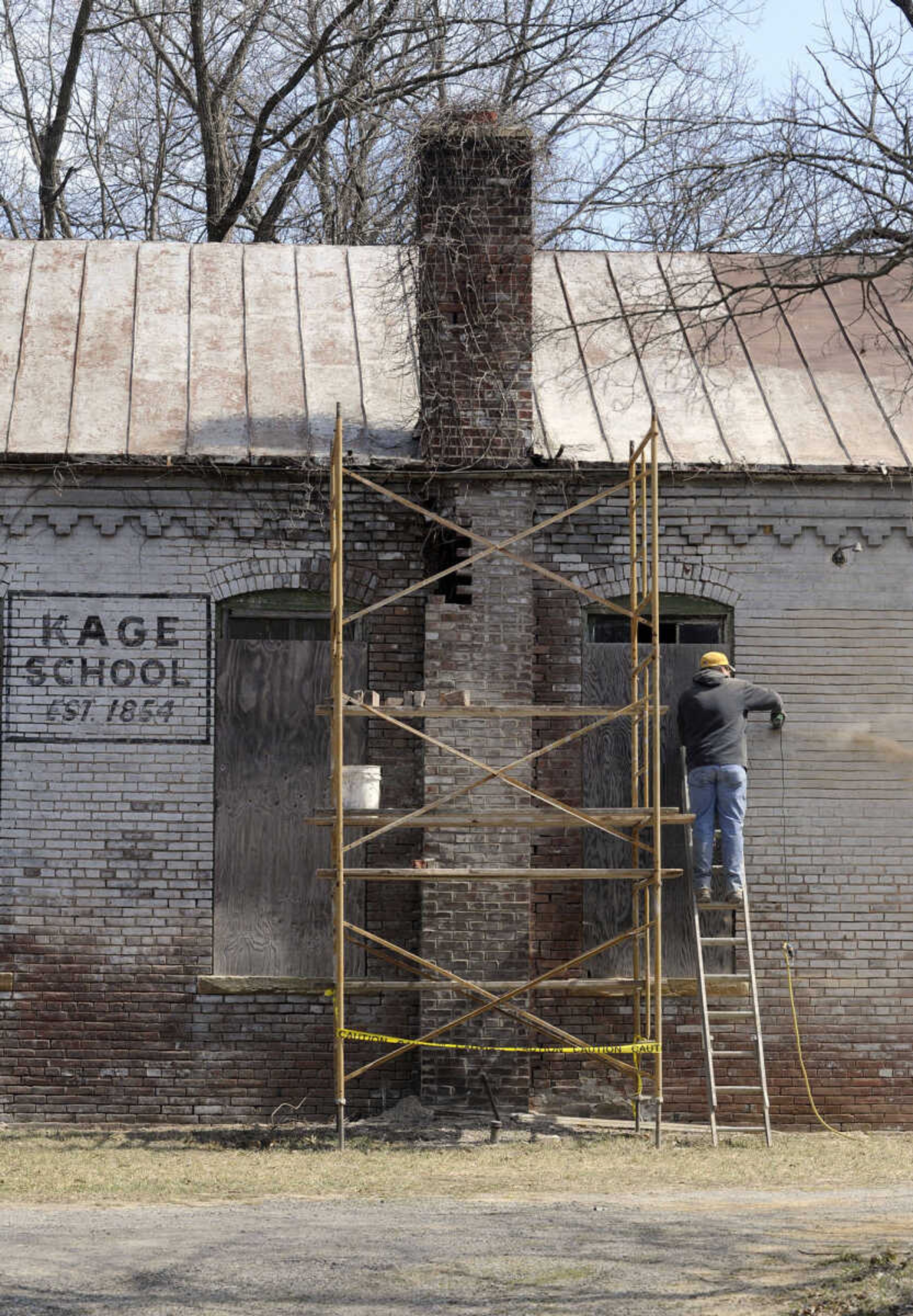 FRED LYNCH ~ flynch@semissourian.com
Chimney work is part of the restoration at the old Kage School as seen Monday, March 24, 2014 in Cape Girardeau. The building served as a one-room school for 112 years until 1966.