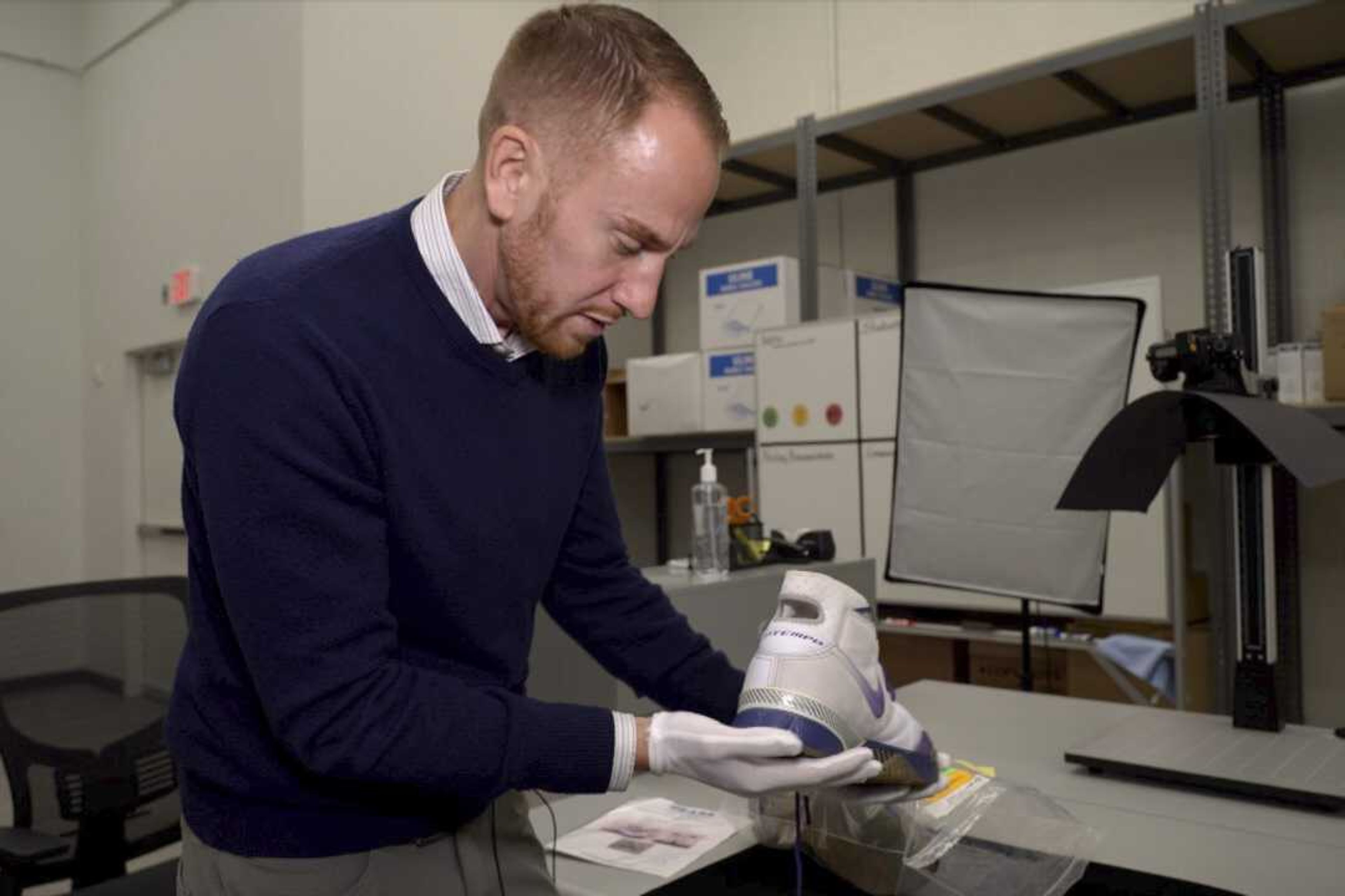 Ross Hoffman, CEO of Collectors Vault, shows a shoe worn and signed by NBA legend Kobe Bryant, on Oct. 21 in Delaware. The footwear is among hundreds of items stored at Collectors Vault, a new venture that makes it easier for collectors to store and trade memorabilia.