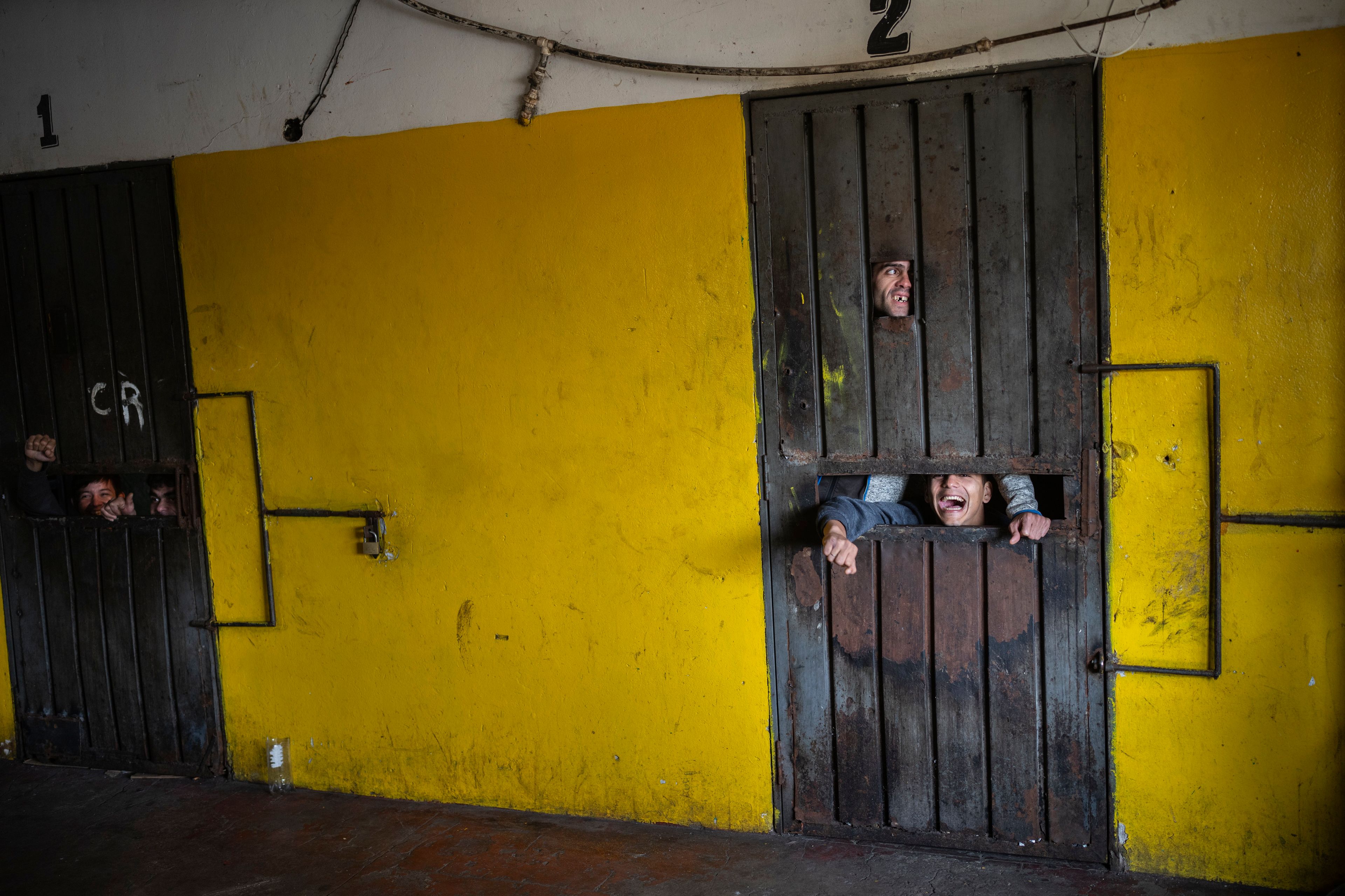 Prisoners talk to other prisoners through the gaps of a cell where they serve out punishment for trying to start a riot at the Juan de la Vega prison in Emboscada, Paraguay, Friday, July 12, 2024. (AP Photo/Rodrigo Abd)